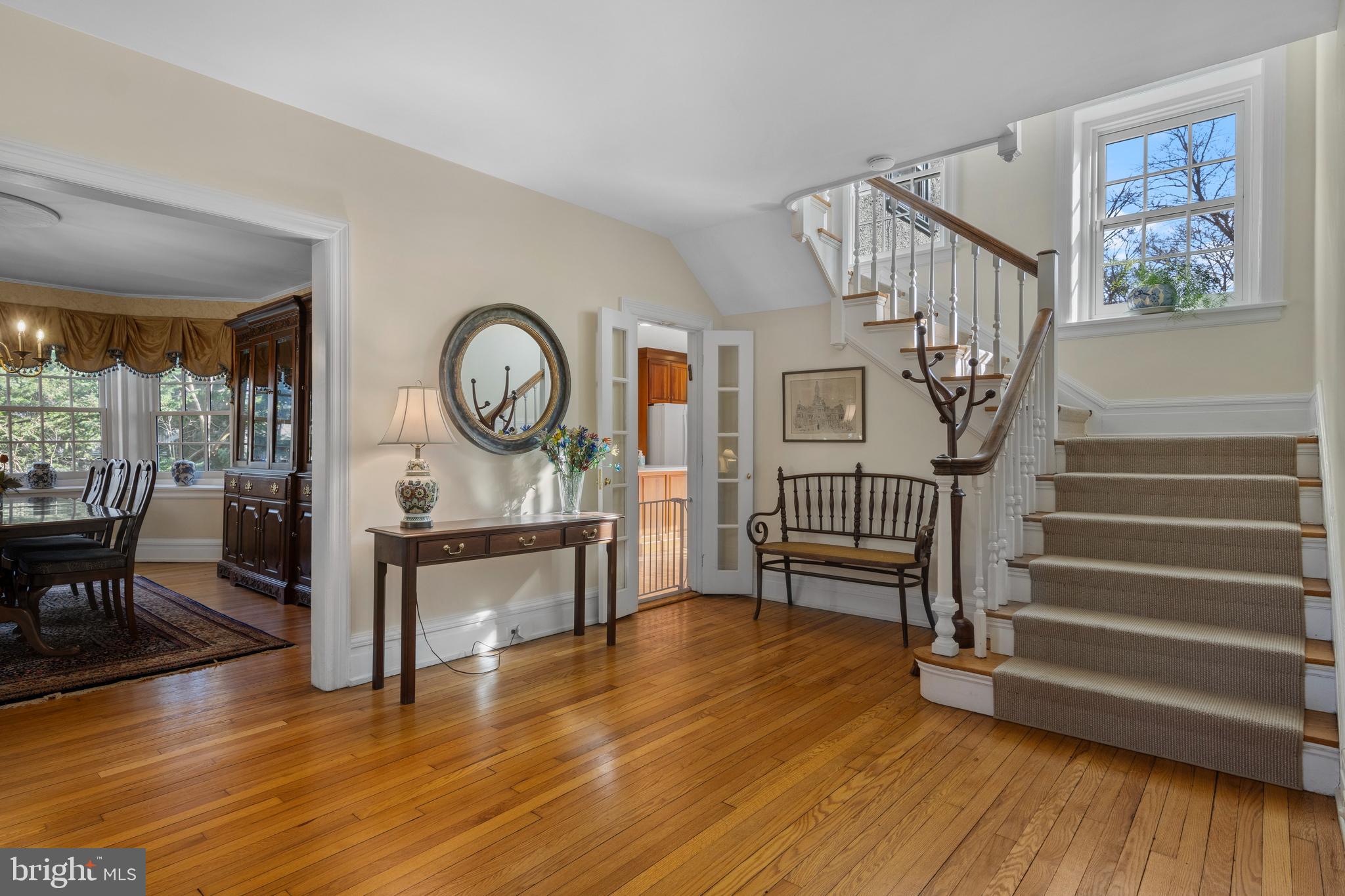 345 Llandrillo Road Bala Cynwyd, PA 19004 - Photo 6 of 54 a view of a livingroom with furniture wooden floor a fireplace and windows