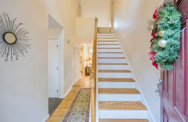 a front view of a house with a potted plant