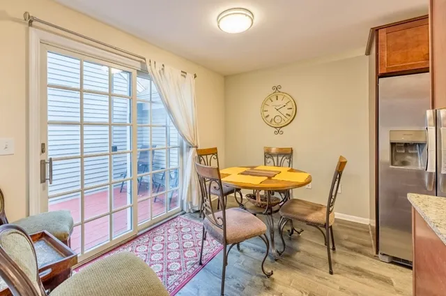 a view of a room with furniture and a window