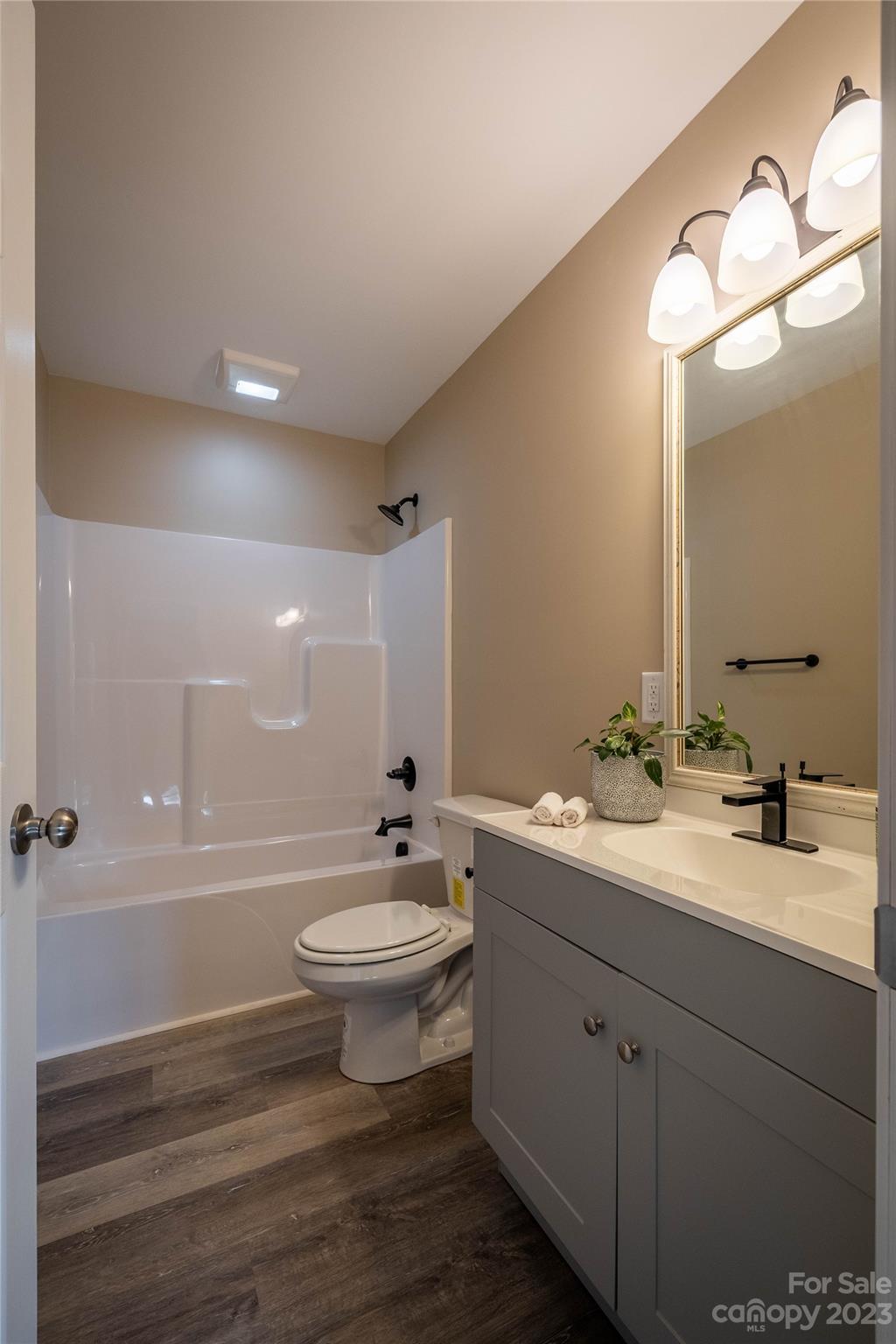 1237 Coffey Road Morganton, NC 28655 - Photo 12 of 19 a bathroom with a double vanity sink toilet mirror and bathtub