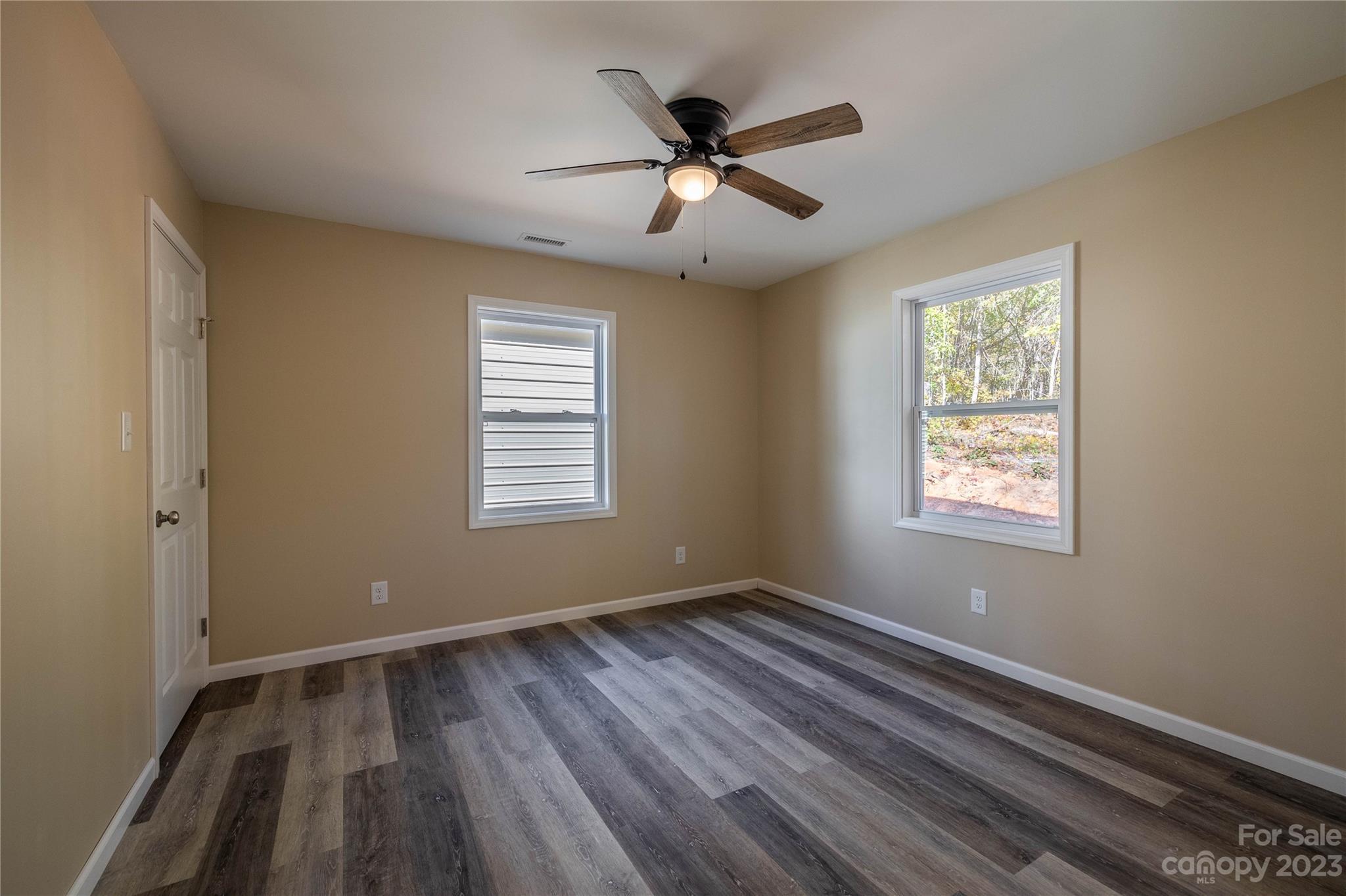 1237 Coffey Road Morganton, NC 28655 - Photo 15 of 19 a view of an empty room with wooden floor and a window