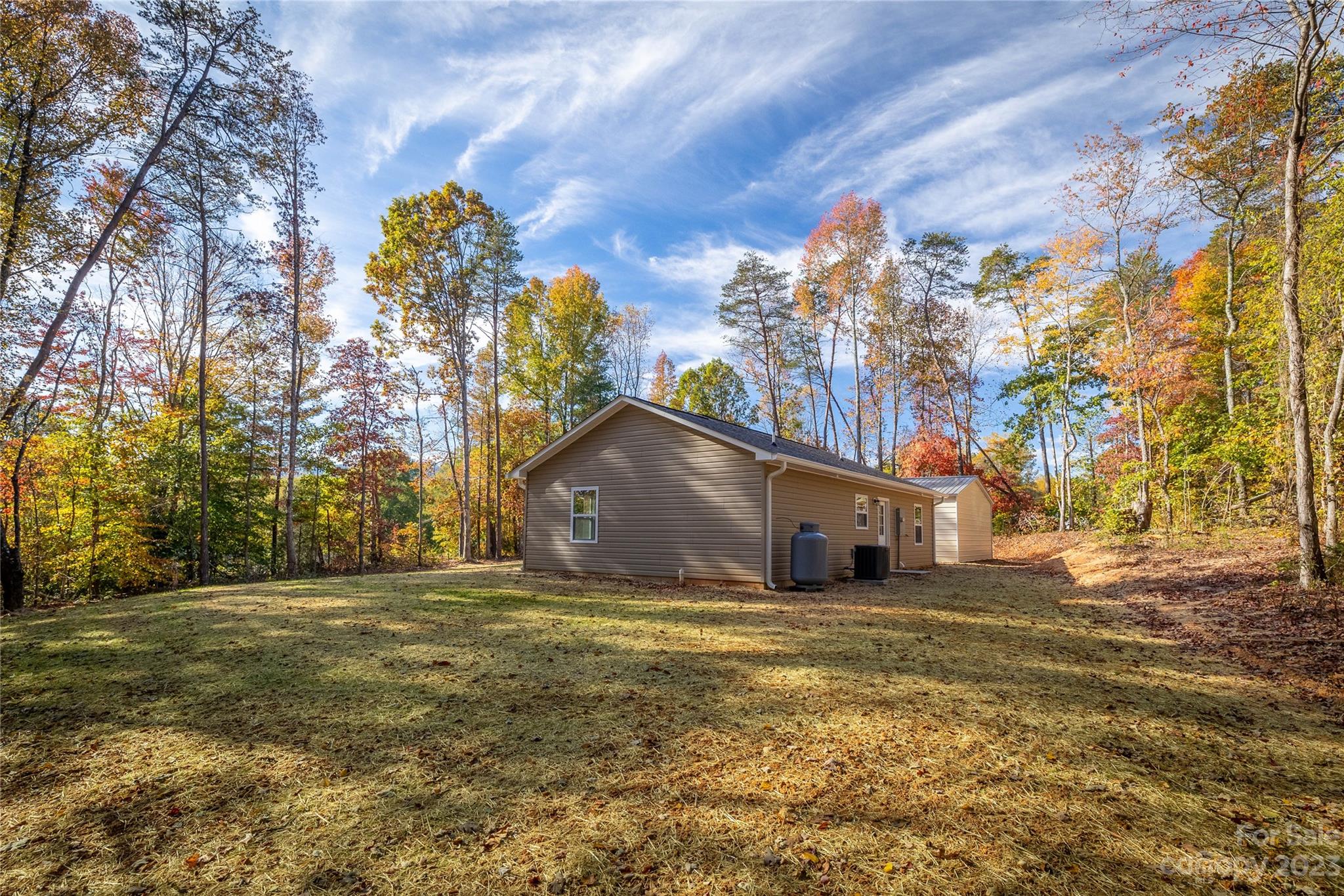 1237 Coffey Road Morganton, NC 28655 - Photo 19 of 19 a big house with a big yard and large trees