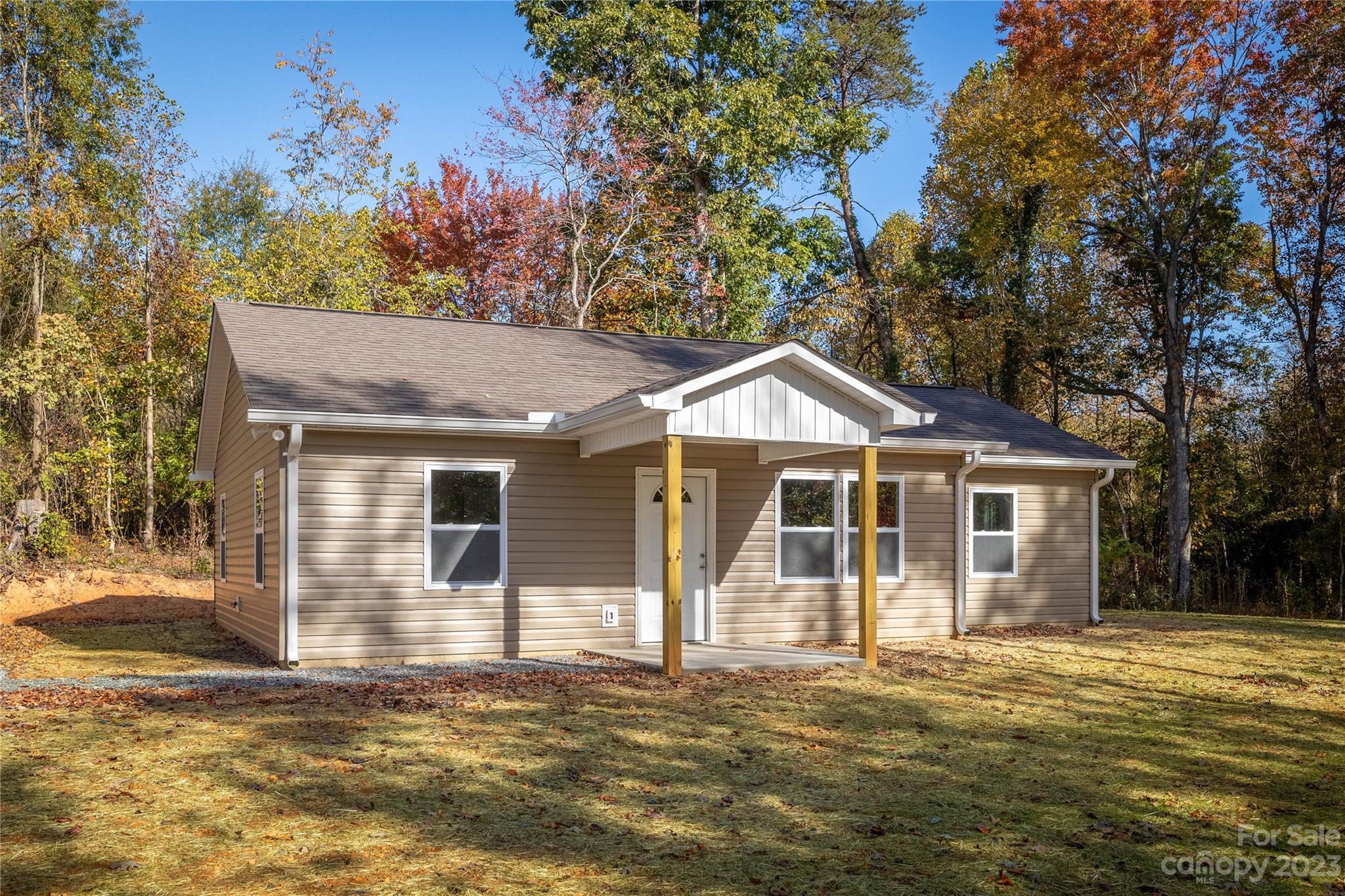 1237 Coffey Road Morganton, NC 28655 - Photo 3 of 19 a front view of a house with a garden