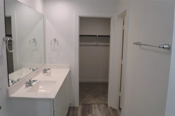 a bathroom with a sink and mirror
