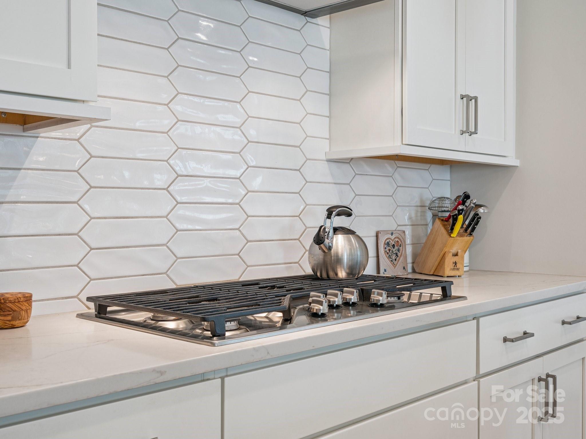 4013 Ashton Ridge Lane Charlotte, NC 28226 - Photo 11 of 36 a stove top oven sitting inside of a kitchen