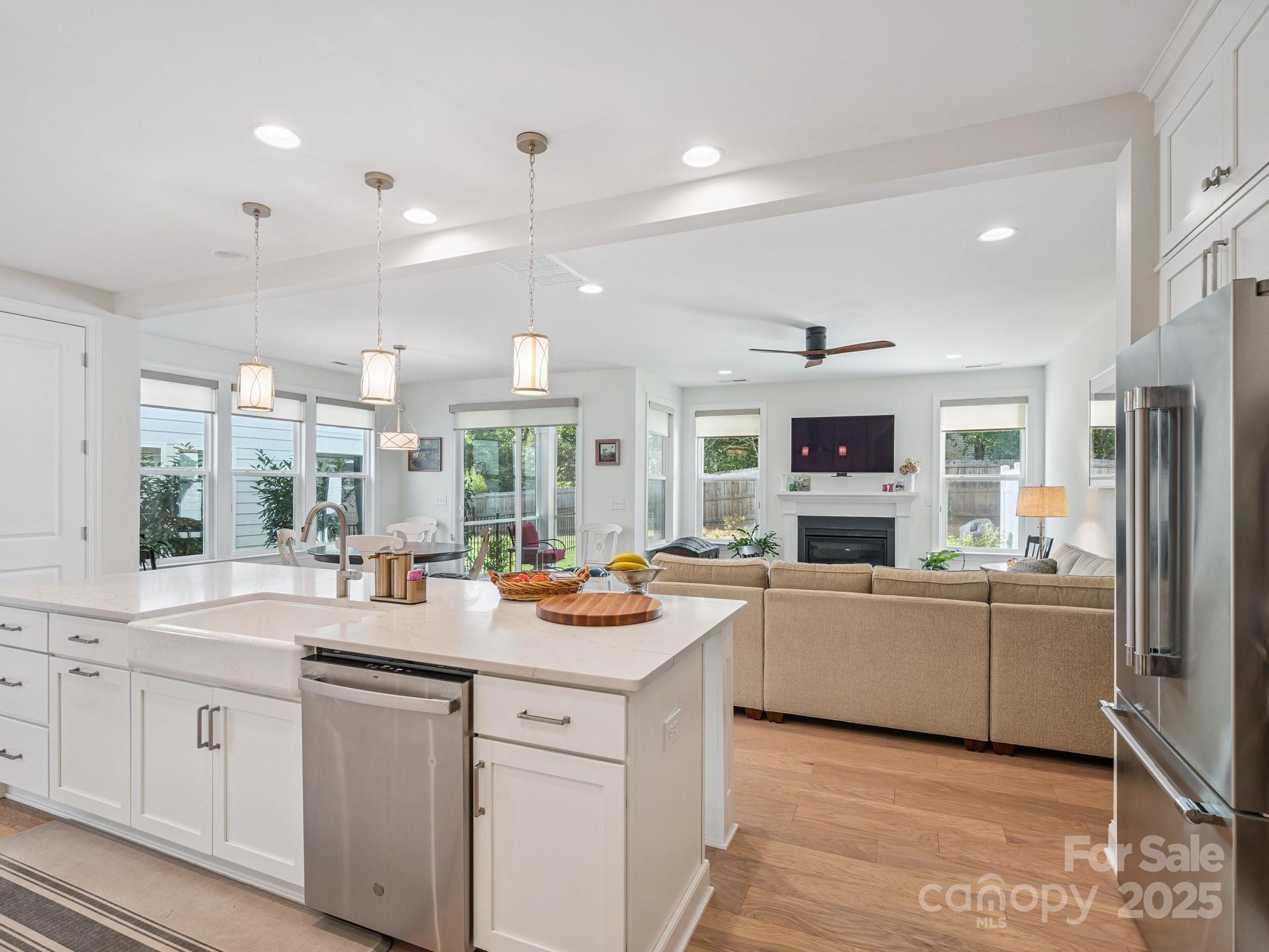 4013 Ashton Ridge Lane Charlotte, NC 28226 - Photo 13 of 36 a kitchen with white cabinets and appliances