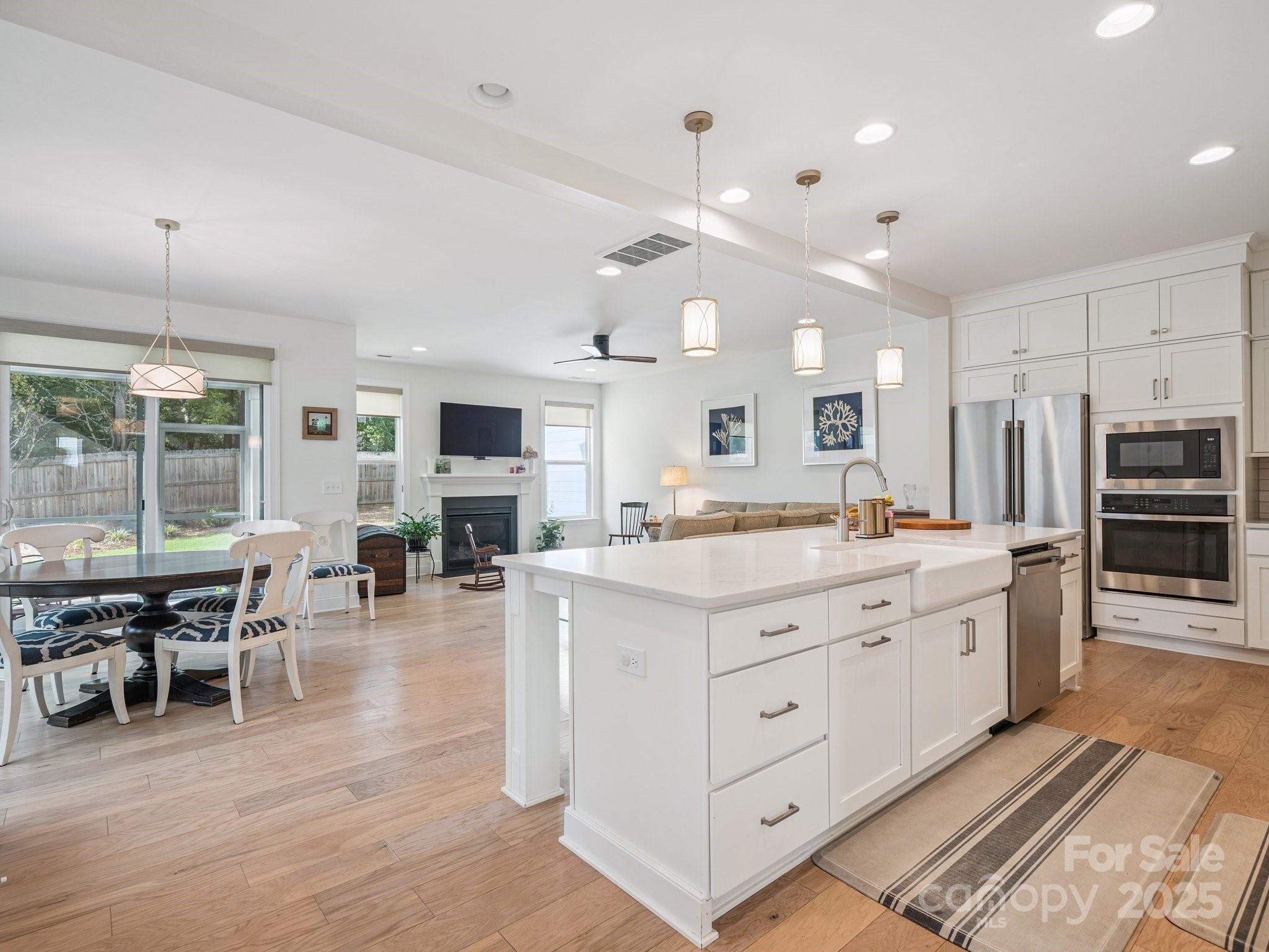 4013 Ashton Ridge Lane Charlotte, NC 28226 - Photo 16 of 36 a large kitchen with lots of counter space and stainless steel appliances