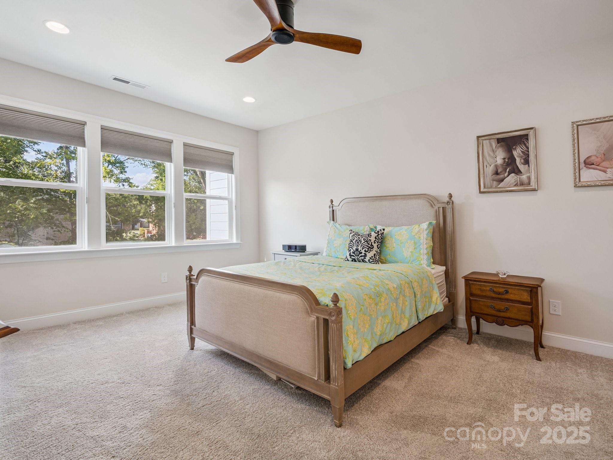 4013 Ashton Ridge Lane Charlotte, NC 28226 - Photo 20 of 36 a bedroom with a bed table and window