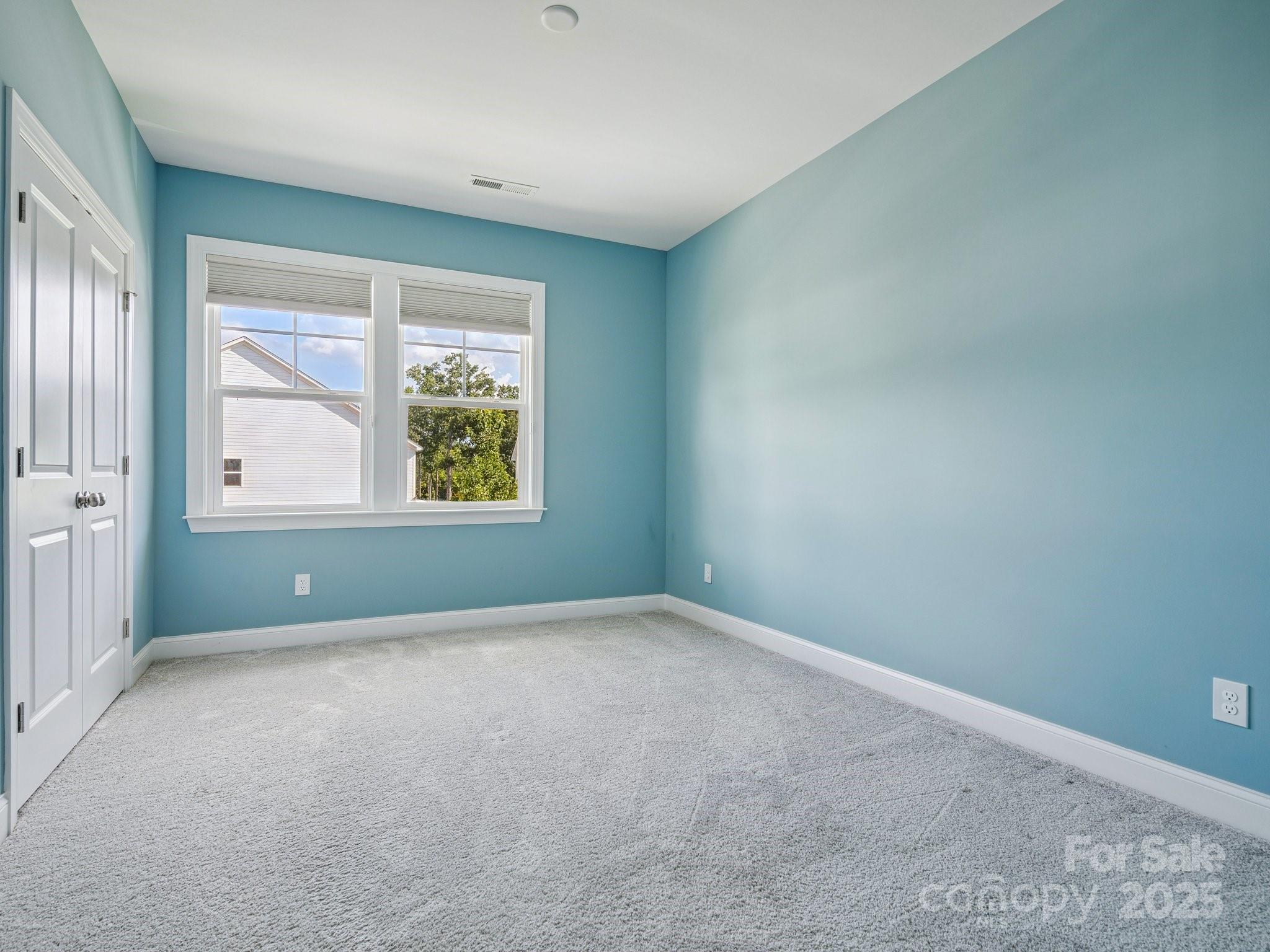 4013 Ashton Ridge Lane Charlotte, NC 28226 - Photo 25 of 36 an empty room with windows
