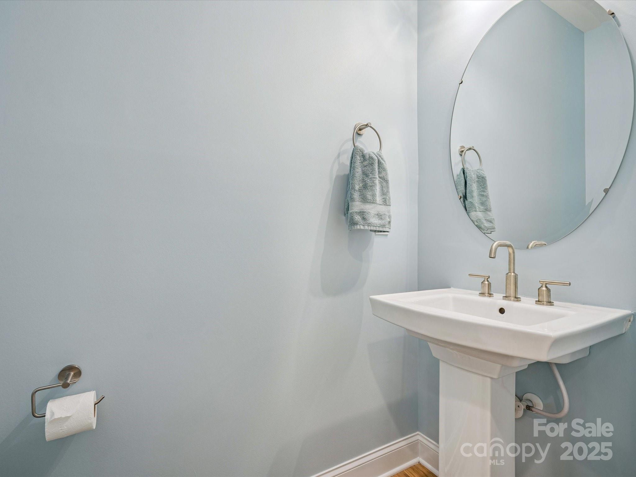 4013 Ashton Ridge Lane Charlotte, NC 28226 - Photo 27 of 36 a bathroom with a sink and mirror