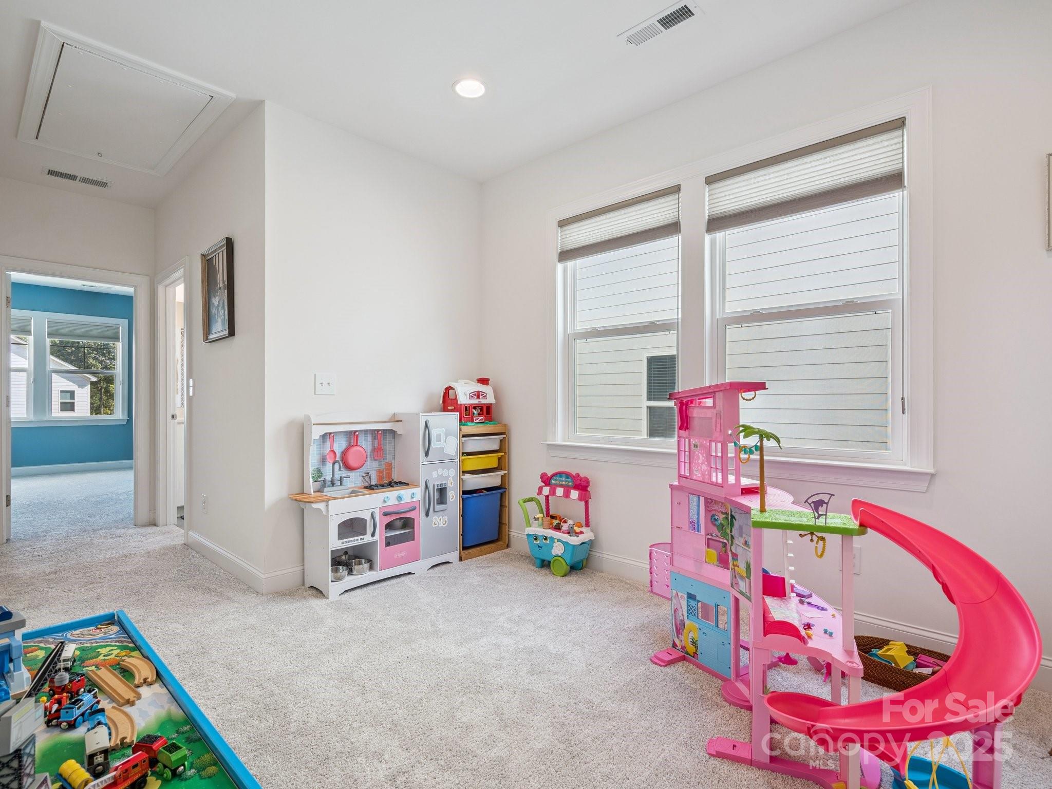 4013 Ashton Ridge Lane Charlotte, NC 28226 - Photo 30 of 36 a bedroom with toys and a small space