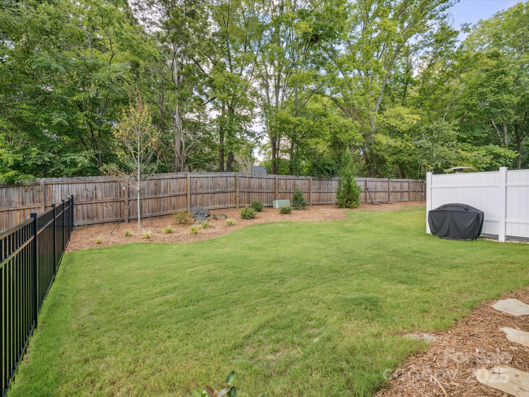 4013 Ashton Ridge Lane Charlotte, NC 28226 - Photo 33 of 36 a view of backyard with trampoline