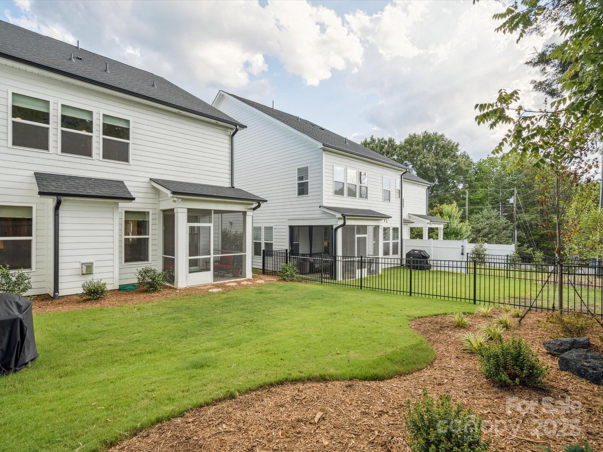 4013 Ashton Ridge Lane Charlotte, NC 28226 - Photo 34 of 36 a view of a house with a yard and sitting area