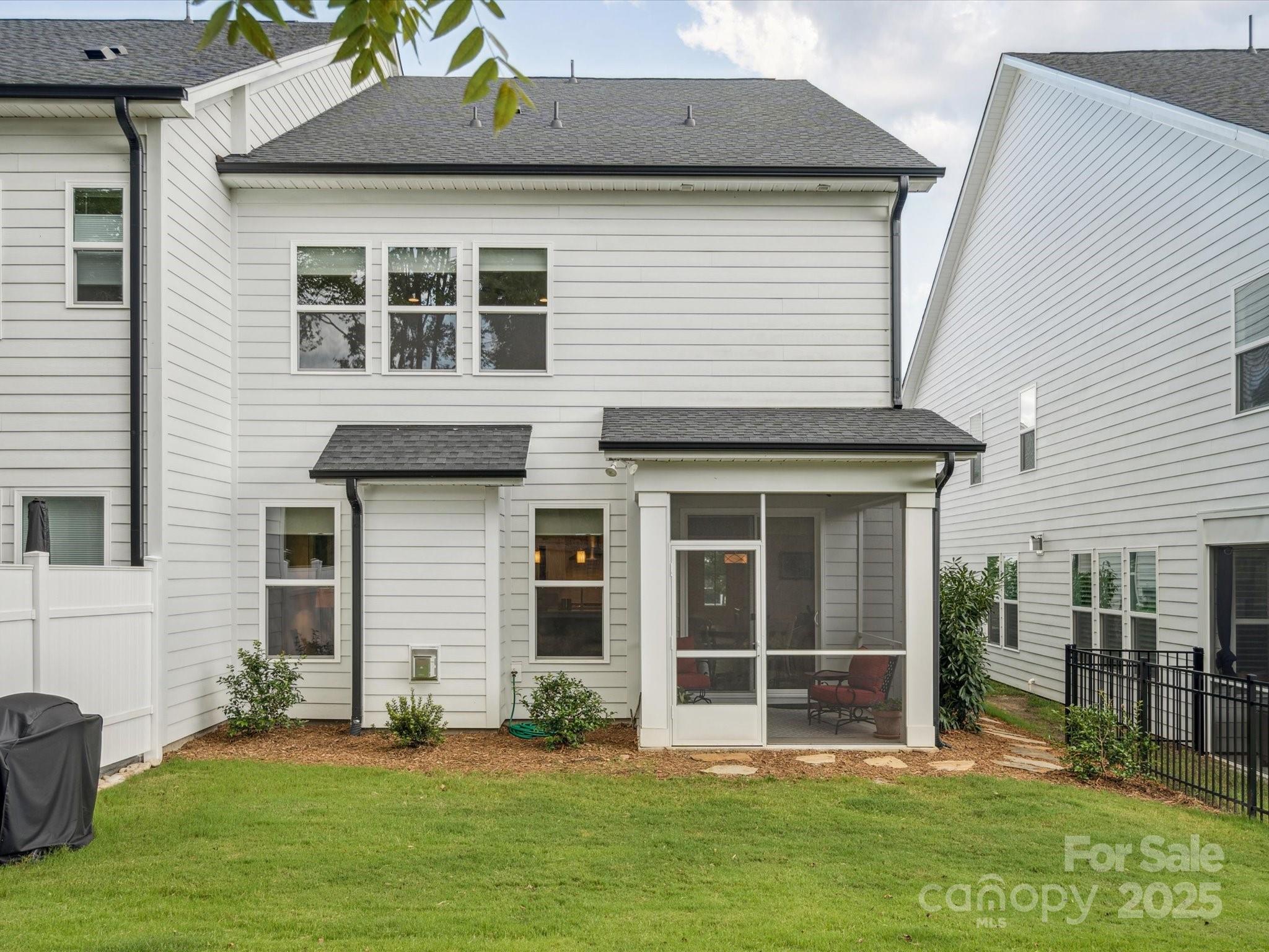 4013 Ashton Ridge Lane Charlotte, NC 28226 - Photo 35 of 36 a front view of a house with a yard