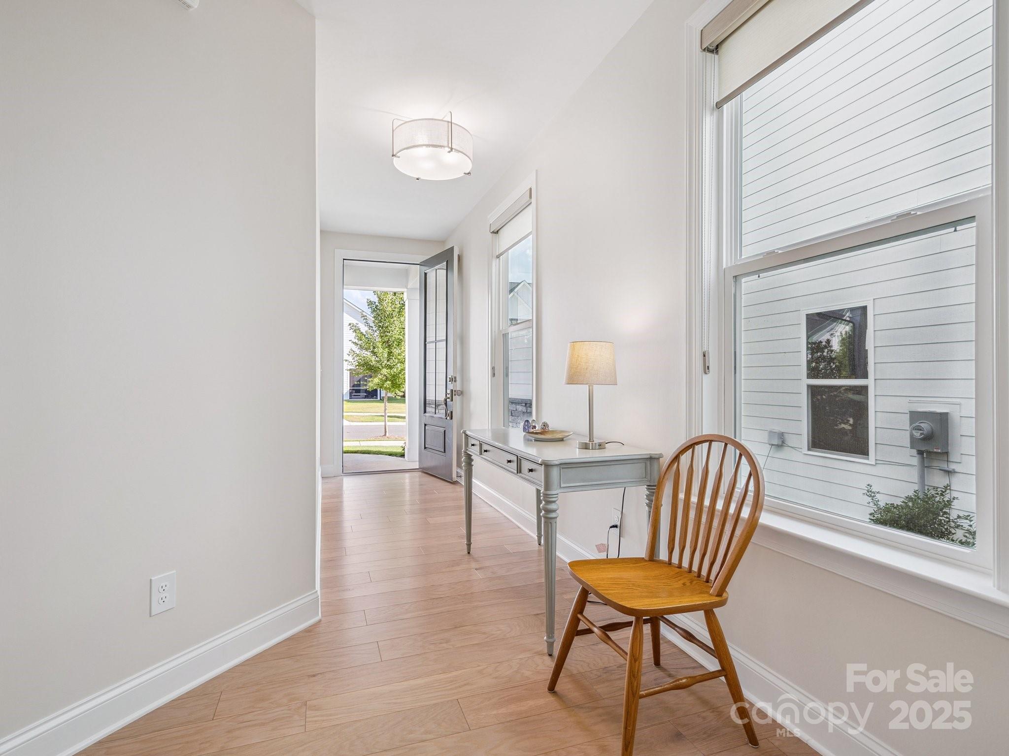 4013 Ashton Ridge Lane Charlotte, NC 28226 - Photo 4 of 36 a view of a room with a window and wooden floor