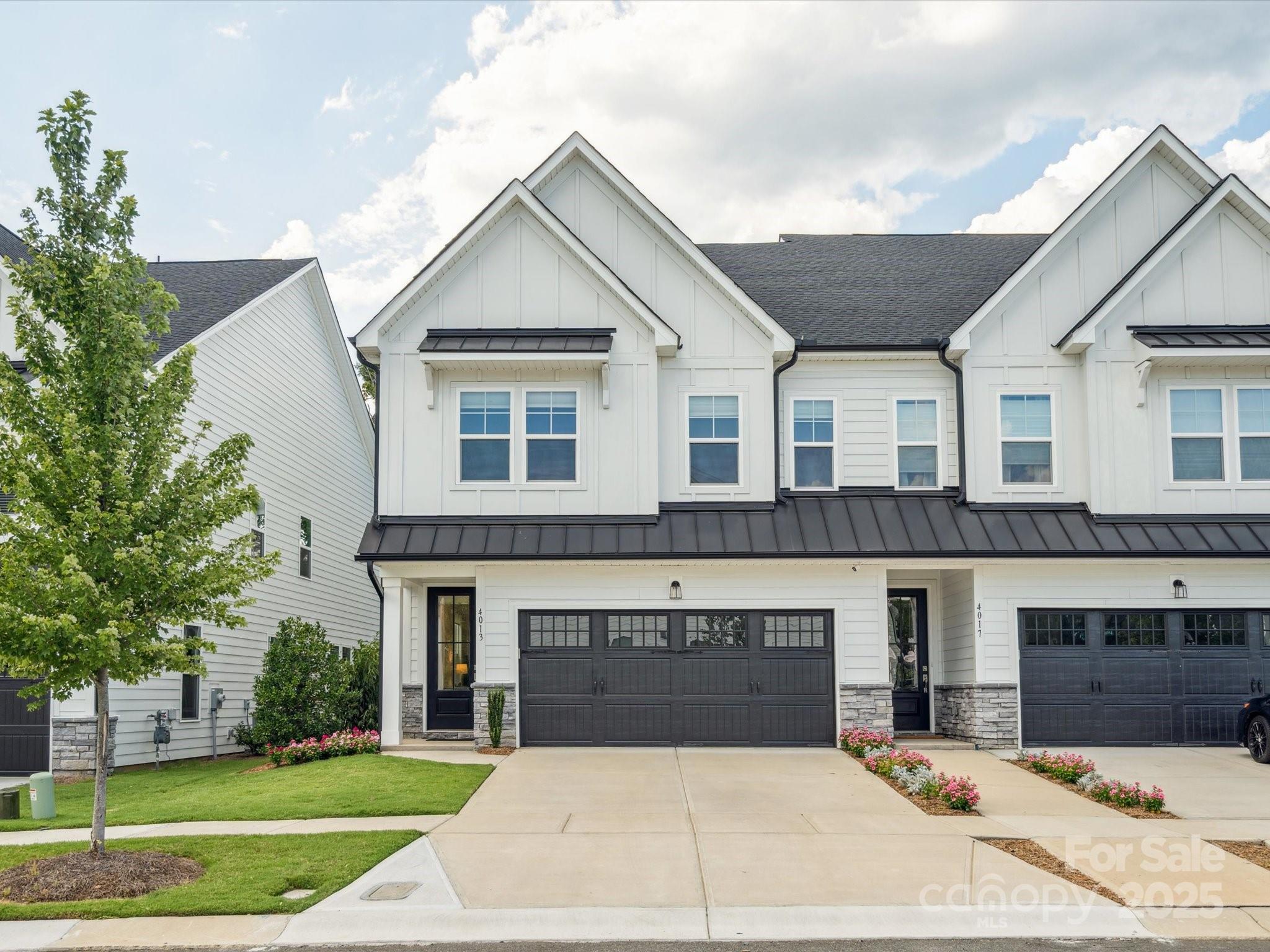 4013 Ashton Ridge Lane Charlotte, NC 28226 - Photo 5 of 36 a front view of a house with a yard