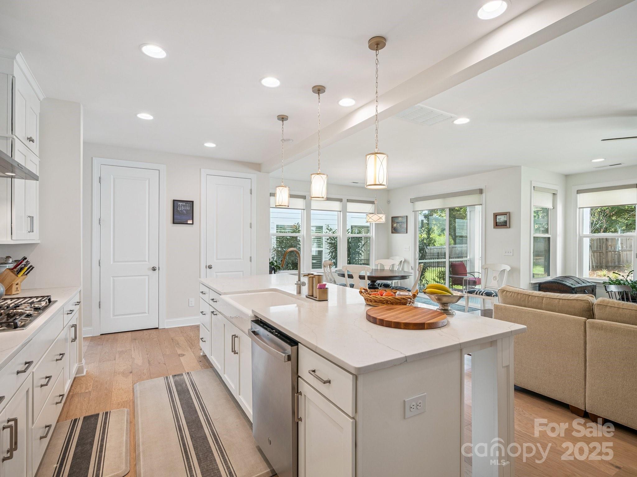 4013 Ashton Ridge Lane Charlotte, NC 28226 - Photo 9 of 36 a kitchen with a sink stove and cabinets