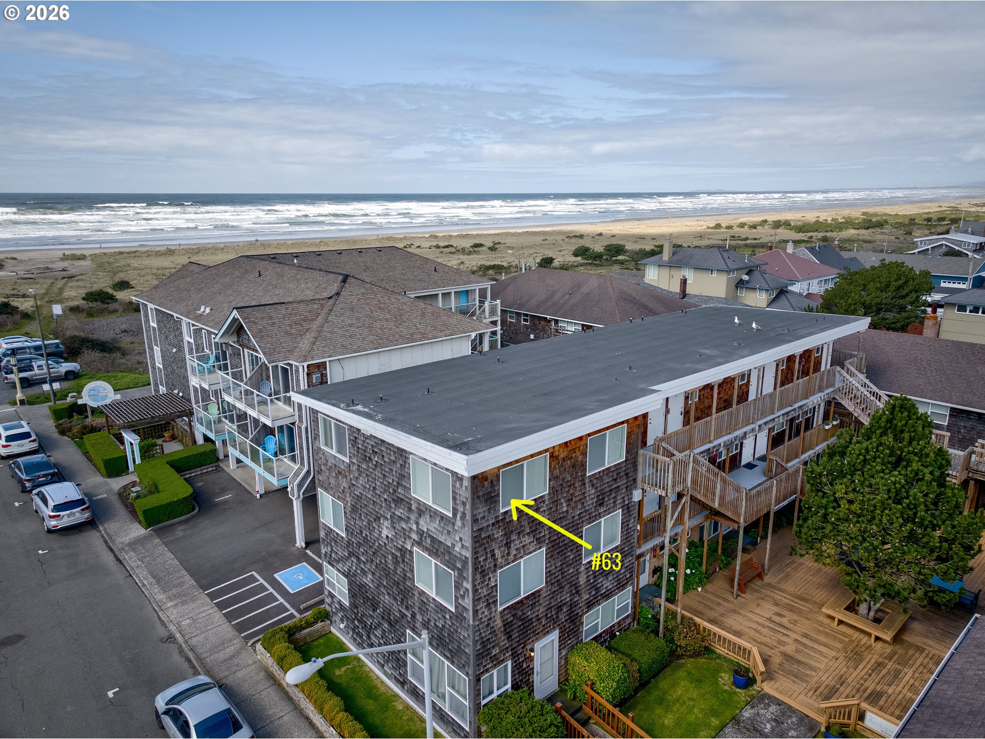 40 Avenue U, Unit 63 Seaside, OR 97138 - Photo 1 of 45 an aerial view of multiple houses with yard