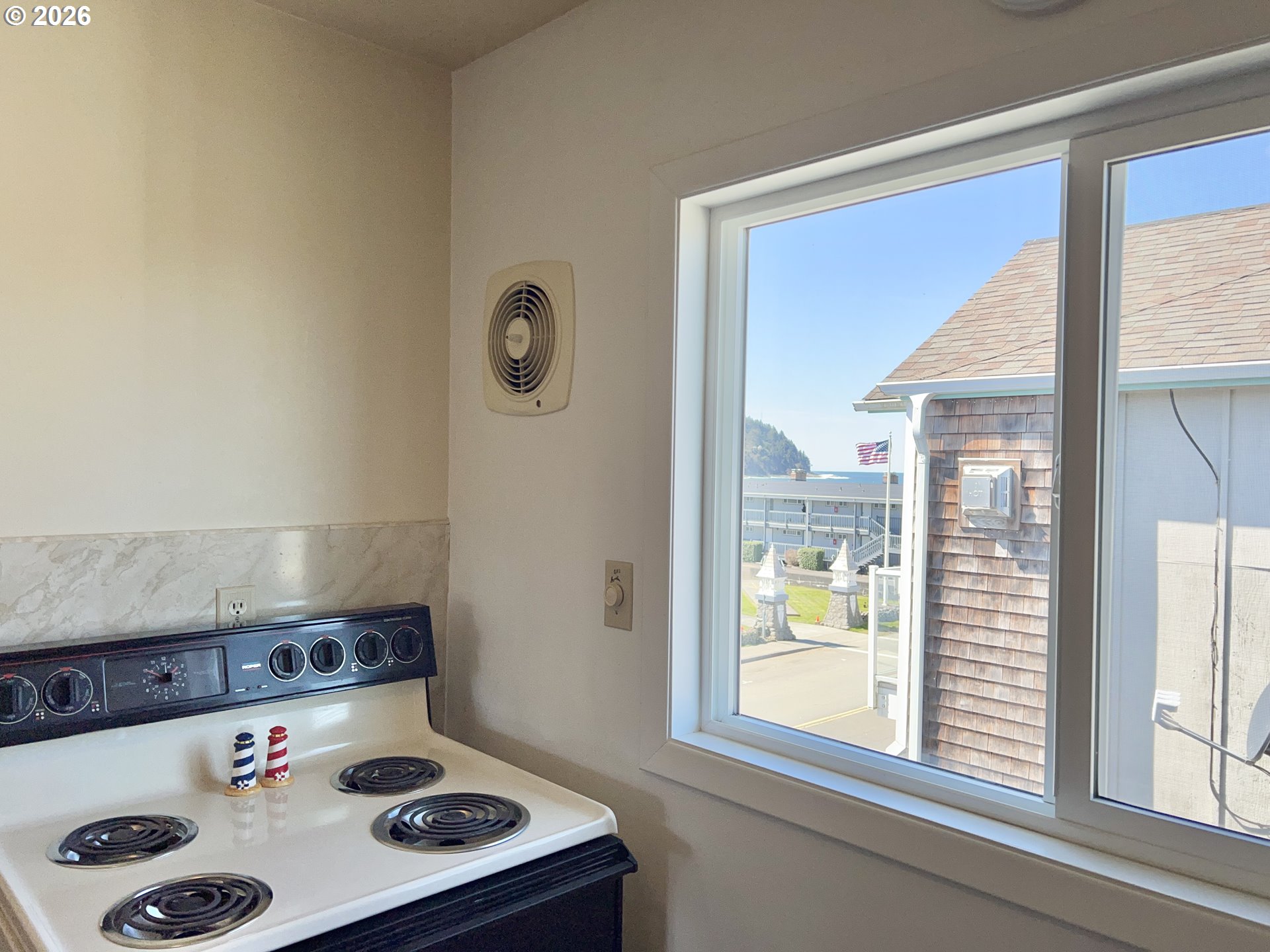 40 Avenue U, Unit 63 Seaside, OR 97138 - Photo 11 of 45 a kitchen with a sink a stove and a refrigerator