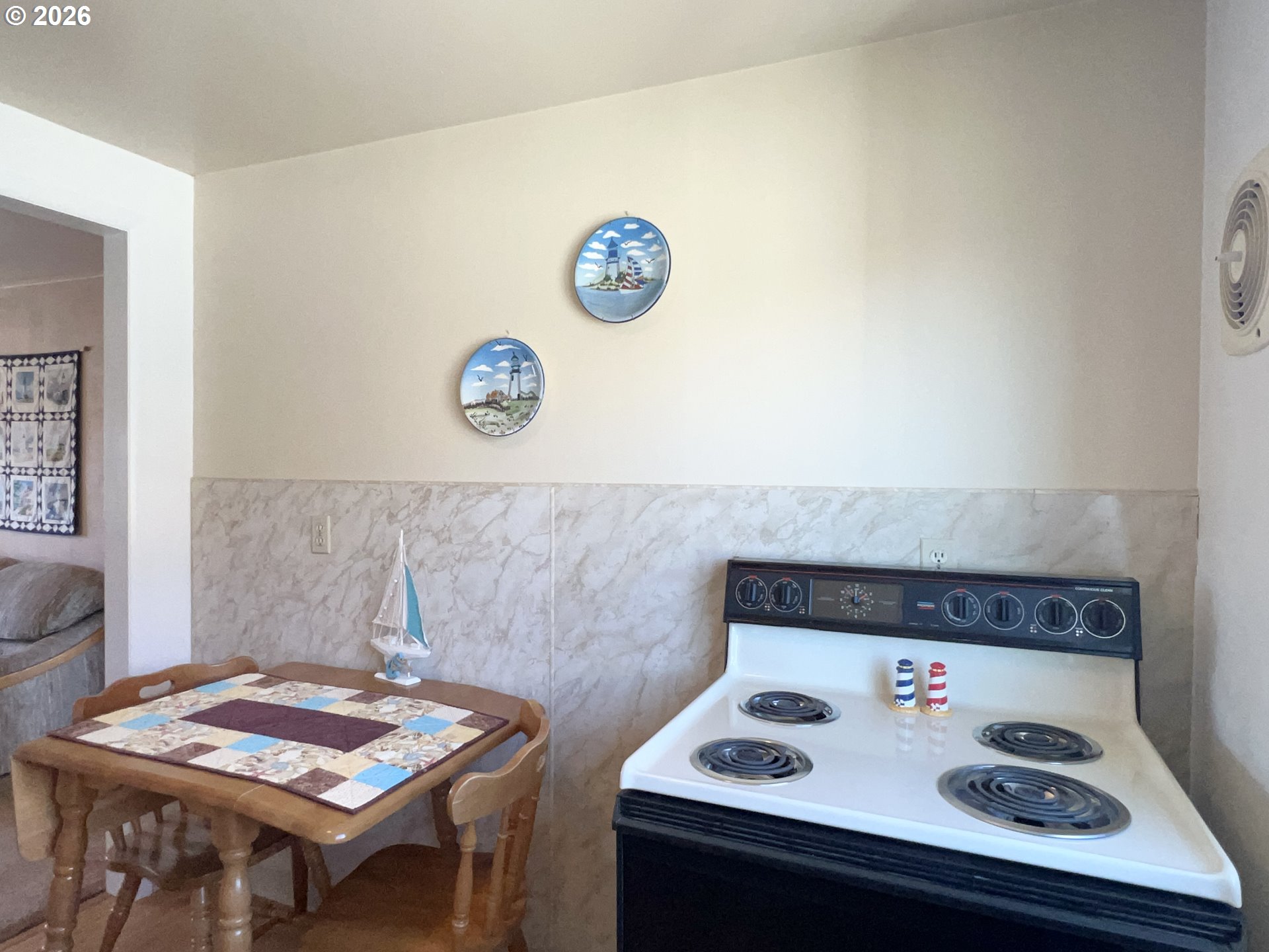 40 Avenue U, Unit 63 Seaside, OR 97138 - Photo 15 of 45 a view of kitchen island with stove