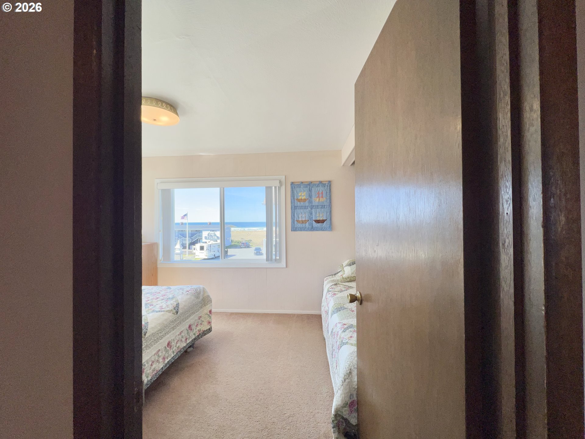 40 Avenue U, Unit 63 Seaside, OR 97138 - Photo 18 of 45 a bathroom with a sink and a mirror