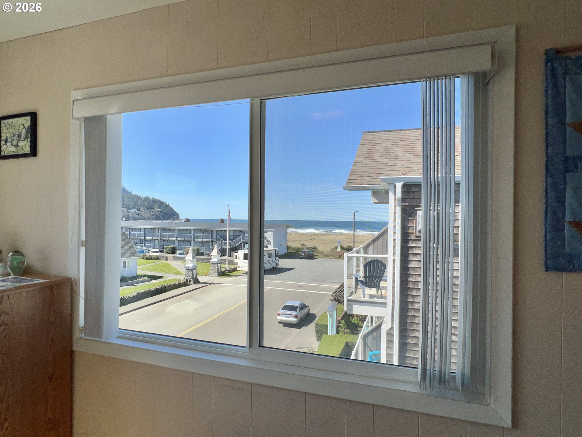 40 Avenue U, Unit 63 Seaside, OR 97138 - Photo 20 of 45 a view of a glass door with a from balcony