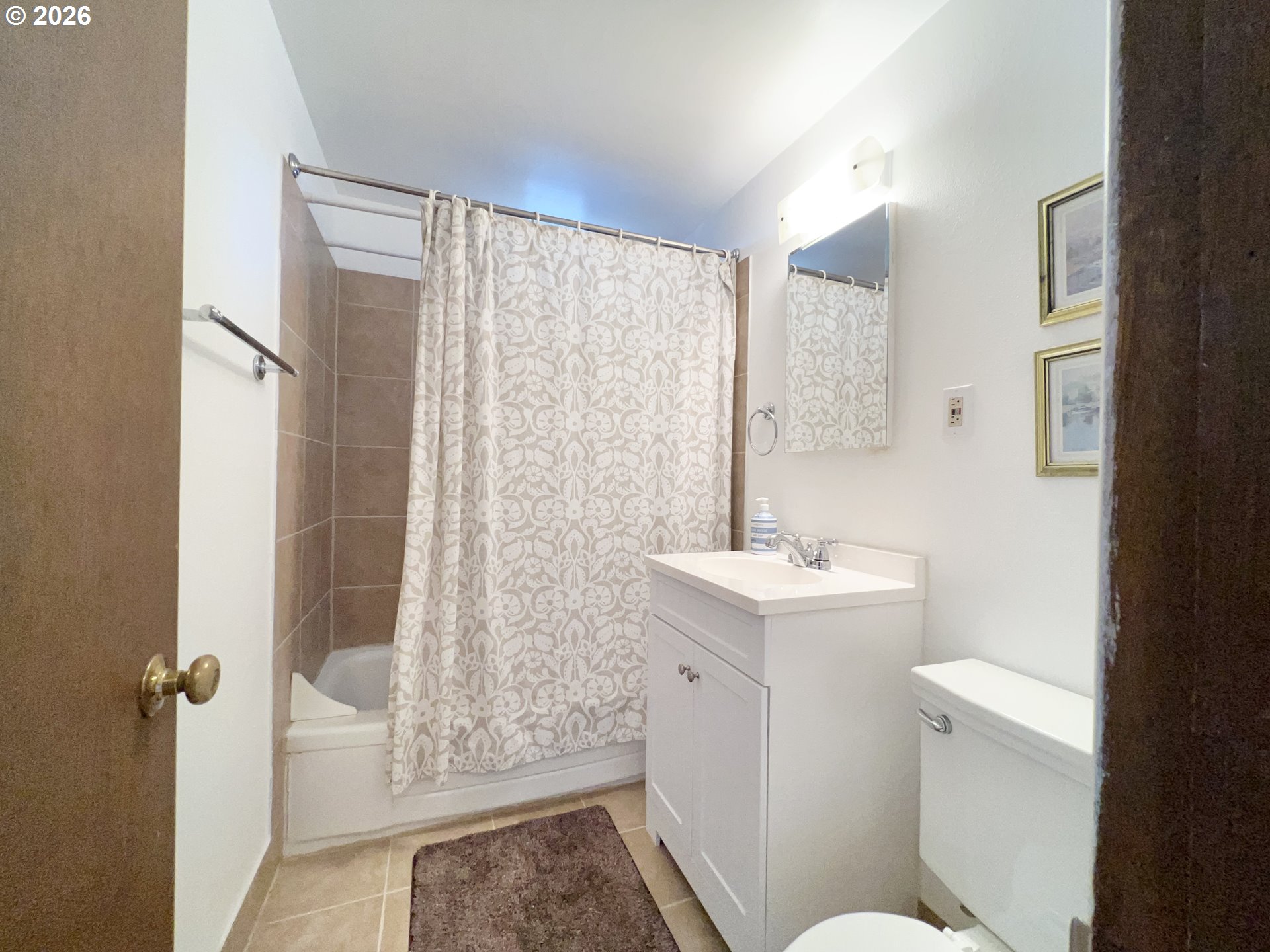 40 Avenue U, Unit 63 Seaside, OR 97138 - Photo 27 of 45 a bathroom with a sink a toilet and shower