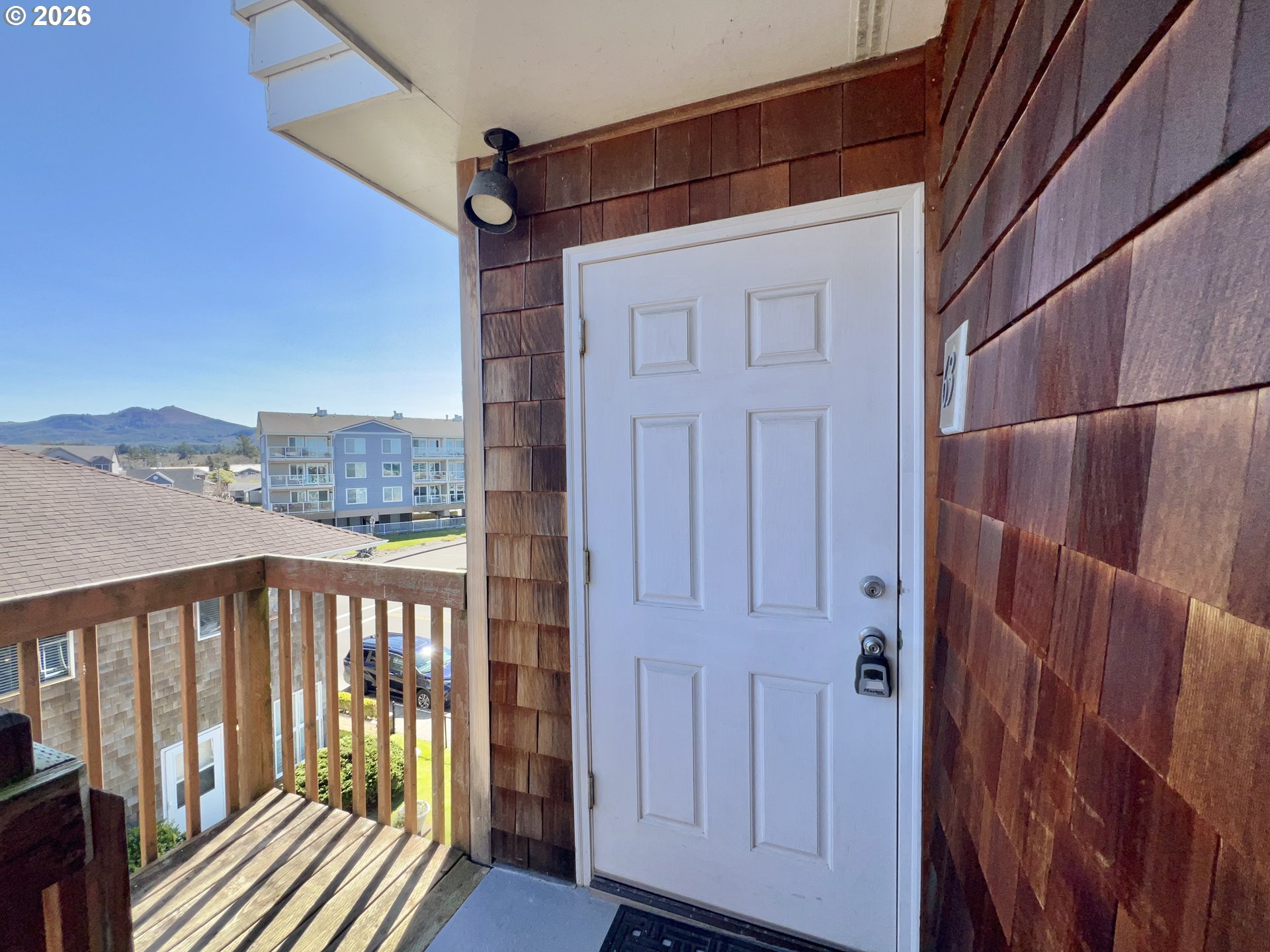 40 Avenue U, Unit 63 Seaside, OR 97138 - Photo 30 of 45 a view of a balcony with wooden floor