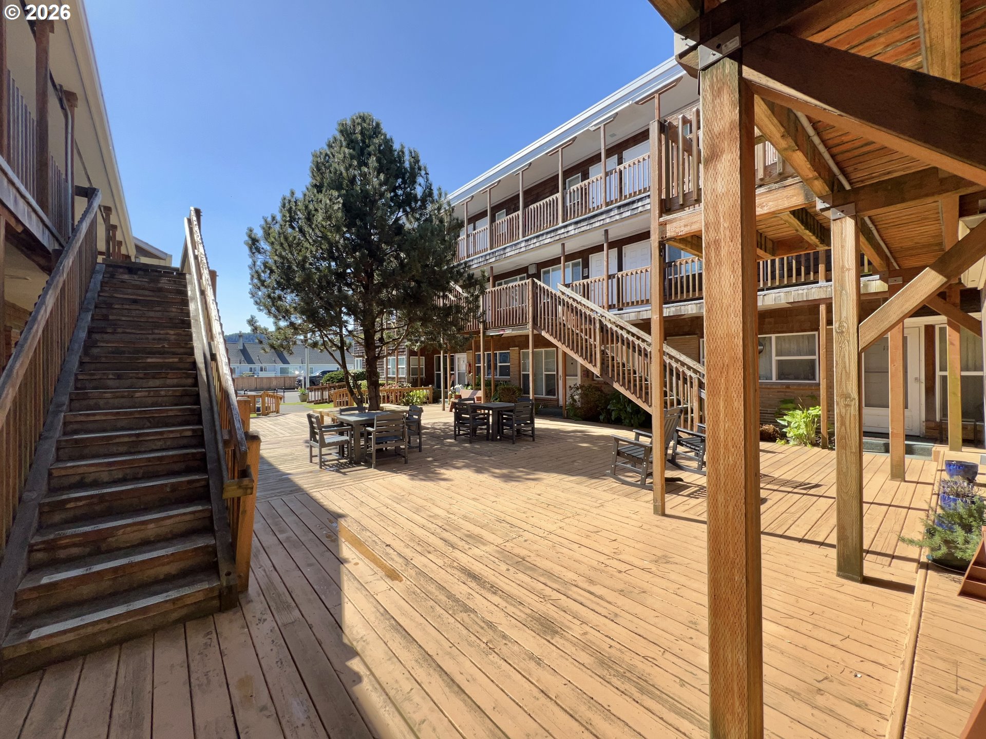 40 Avenue U, Unit 63 Seaside, OR 97138 - Photo 35 of 45 a view of balcony and deck with wooden floor and fence
