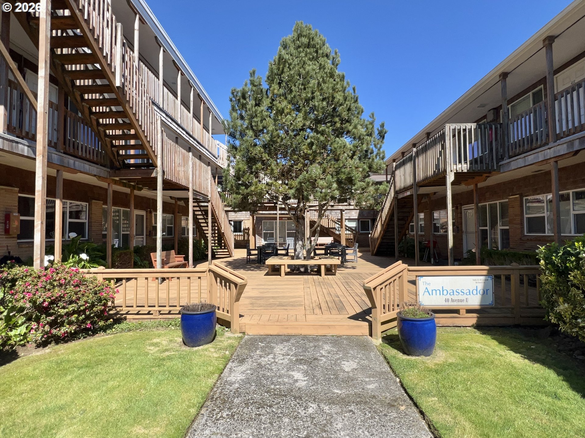 40 Avenue U, Unit 63 Seaside, OR 97138 - Photo 38 of 45 a view of a house with swimming pool and sitting area