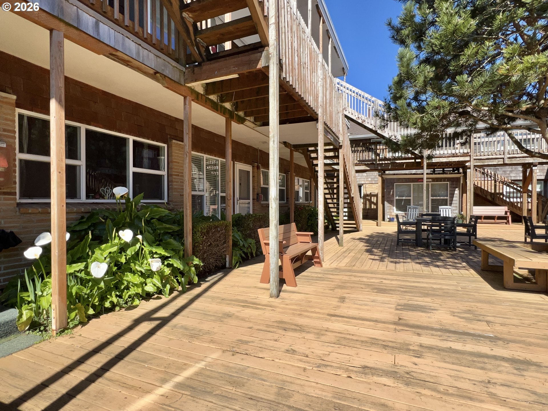 40 Avenue U, Unit 63 Seaside, OR 97138 - Photo 39 of 45 a view of a backyard with sitting area