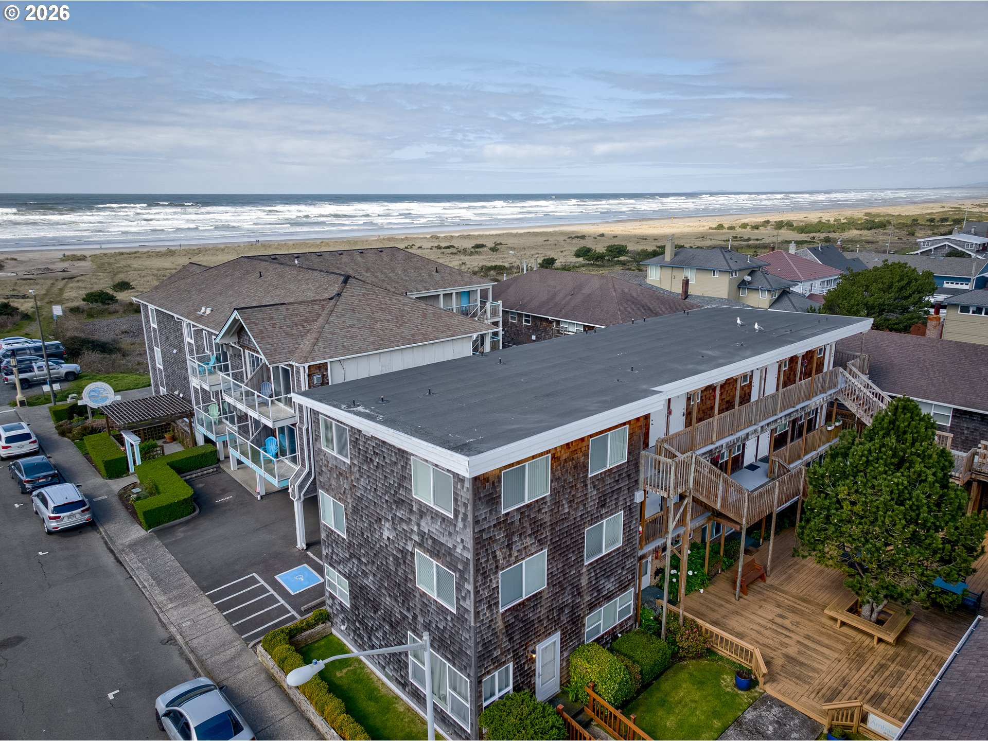 40 Avenue U, Unit 63 Seaside, OR 97138 - Photo 45 of 45 an aerial view of multiple houses with a yard