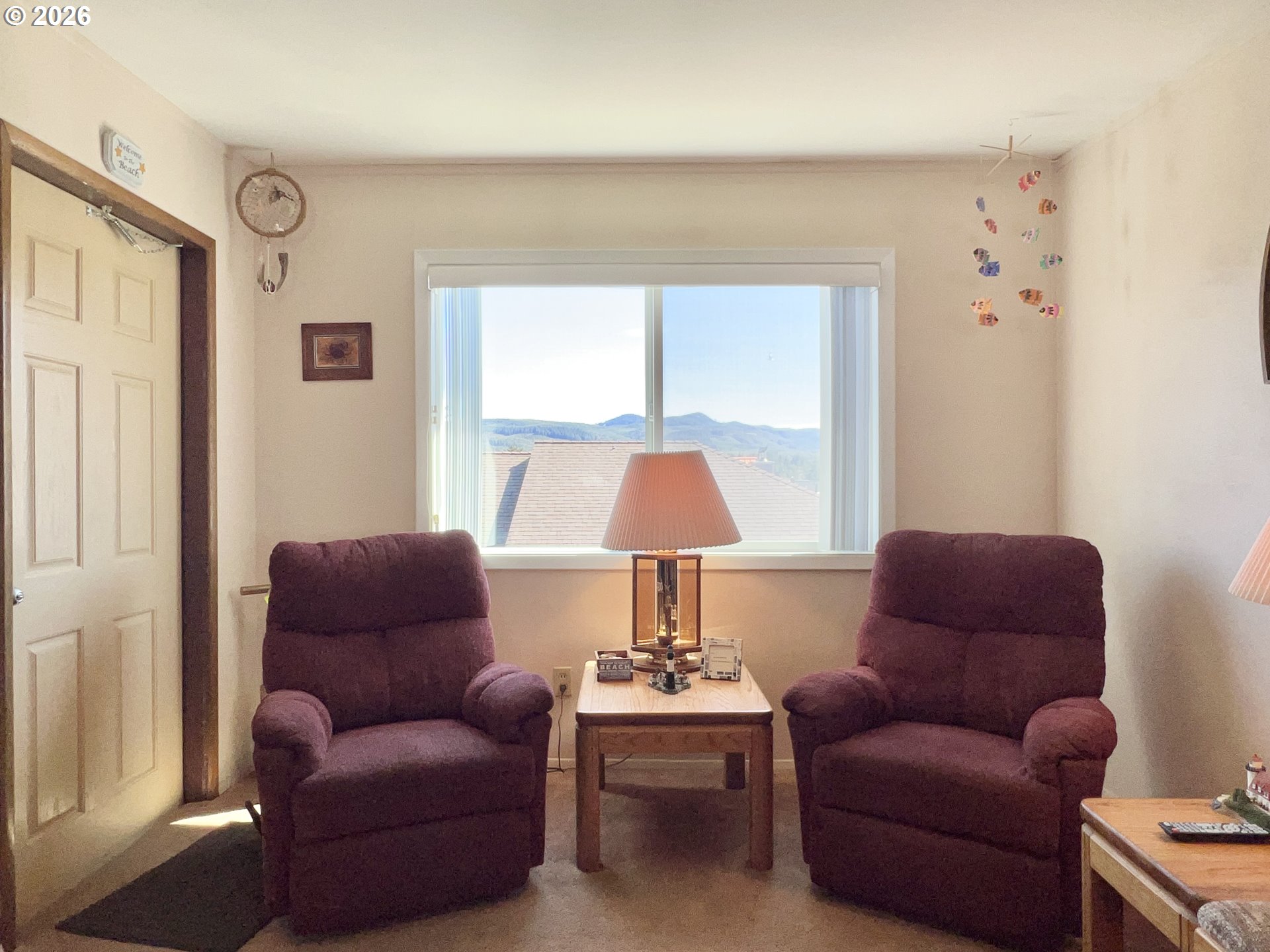 40 Avenue U, Unit 63 Seaside, OR 97138 - Photo 5 of 45 a living room with furniture and a window