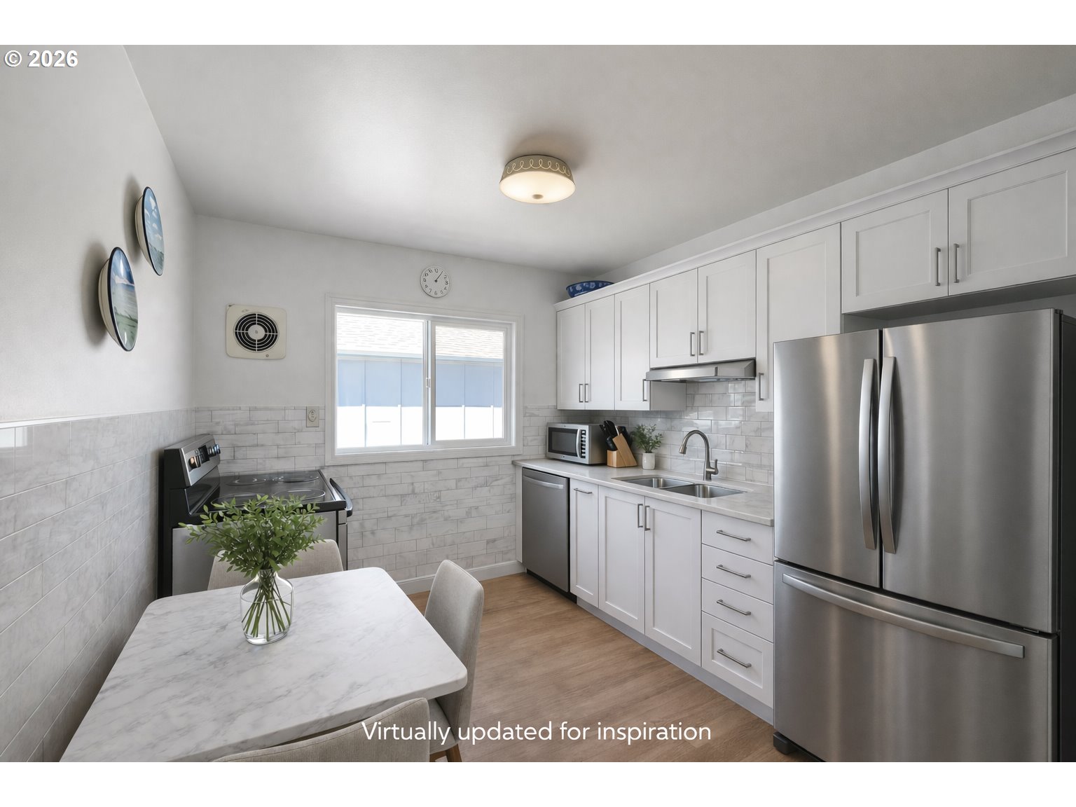40 Avenue U, Unit 63 Seaside, OR 97138 - Photo 9 of 45 a kitchen with stainless steel appliances kitchen island a refrigerator sink and cabinets