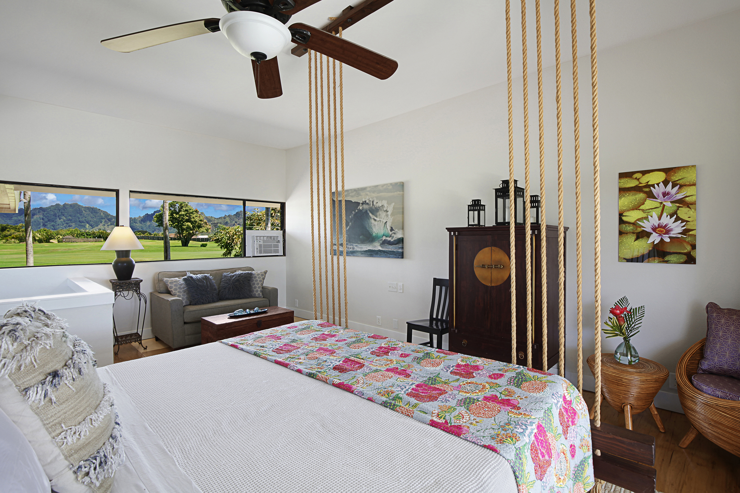 2750 Milo Hae Loop Koloa, HI 96756 - Photo 11 of 23 a bedroom that has a bed dresser and a large window