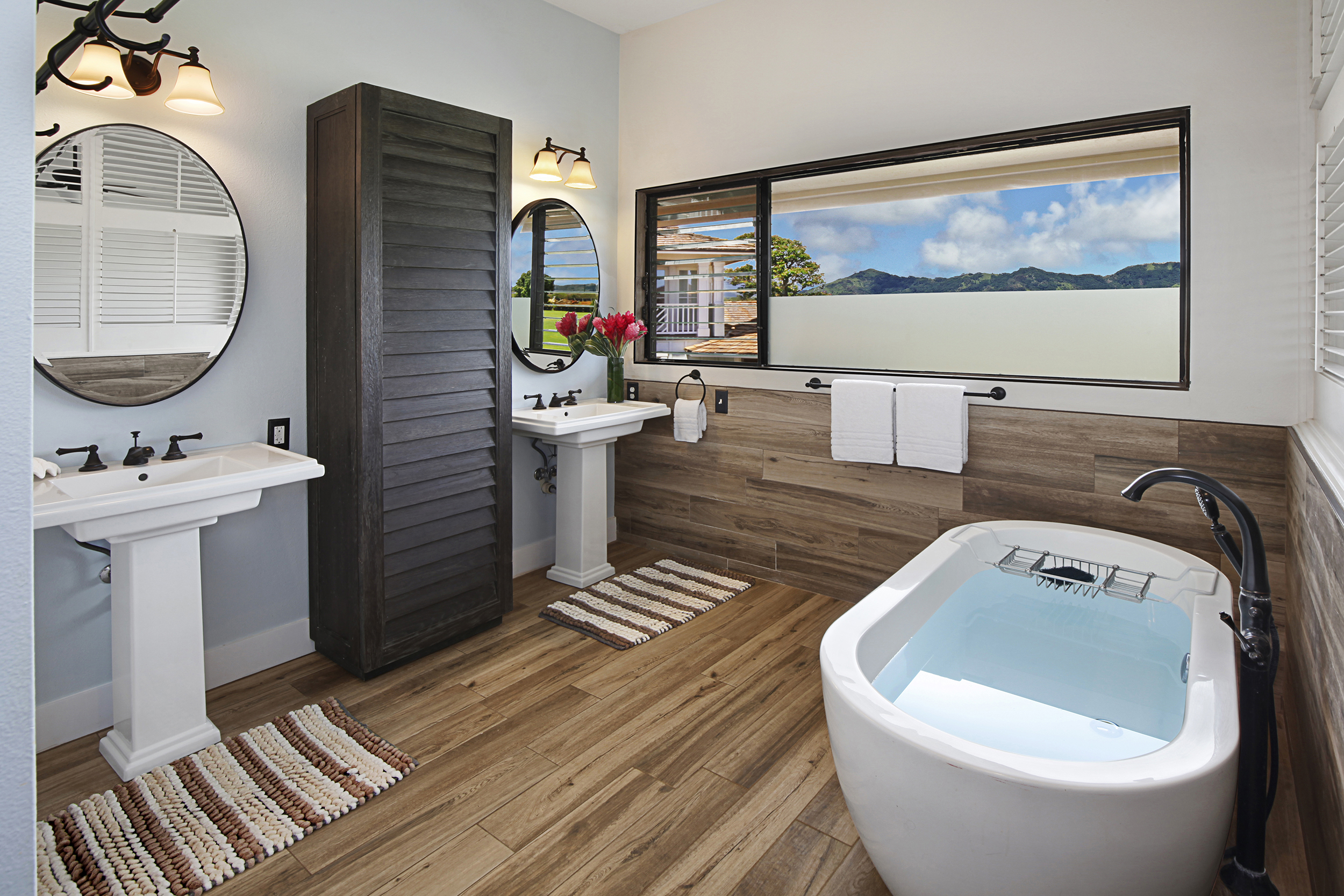 2750 Milo Hae Loop Koloa, HI 96756 - Photo 14 of 23 a bathroom with a toilet a sink and a mirror