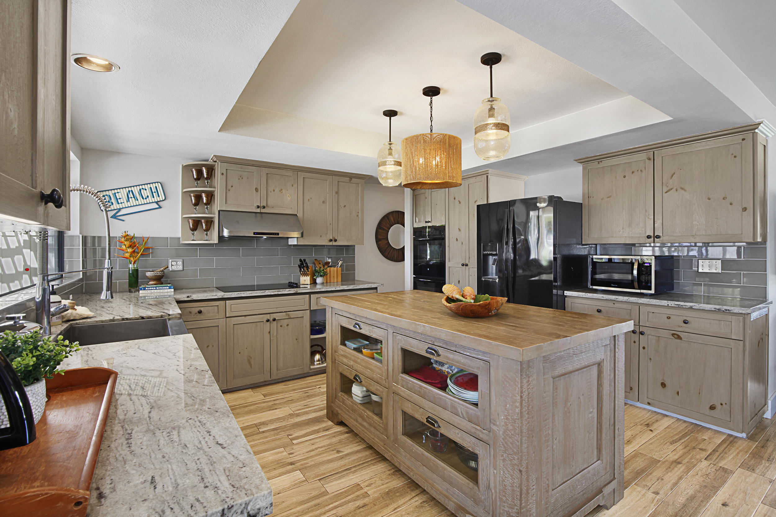 2750 Milo Hae Loop Koloa, HI 96756 - Photo 2 of 23 a kitchen with stainless steel appliances granite countertop a sink a stove and a refrigerator