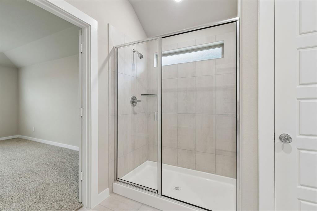 1124 Del Rio Drive Lavon, TX 75166 - Photo 19 of 32 Primary Bathroom in the Emmy II home plan by Trophy Signature Homes - REPRESENTATIVE PHOTO