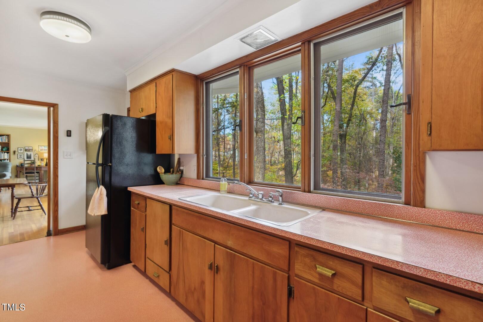 3120 Tanager Street Raleigh, NC 27606 - Photo 22 of 70 a bathroom with a granite countertop sink and a large mirror