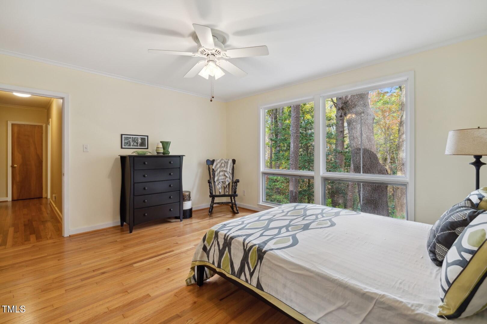 3120 Tanager Street Raleigh, NC 27606 - Photo 24 of 70 a bedroom with a bed closet and a large window