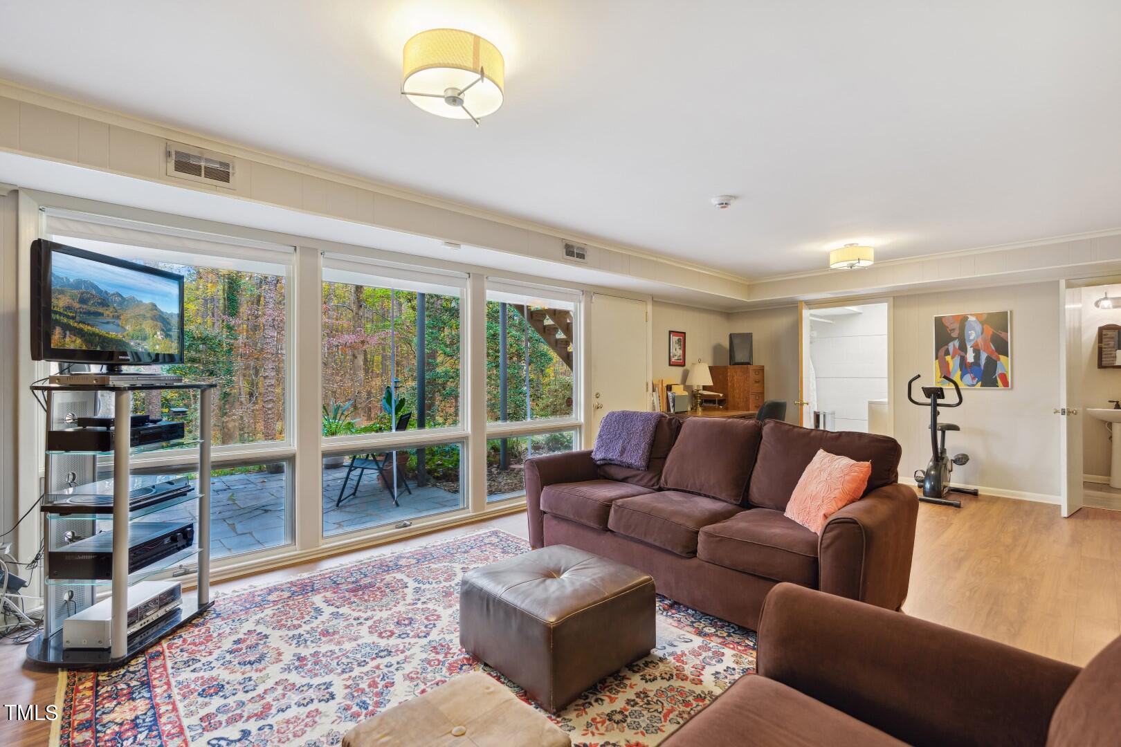3120 Tanager Street Raleigh, NC 27606 - Photo 38 of 70 a living room with furniture and a large window