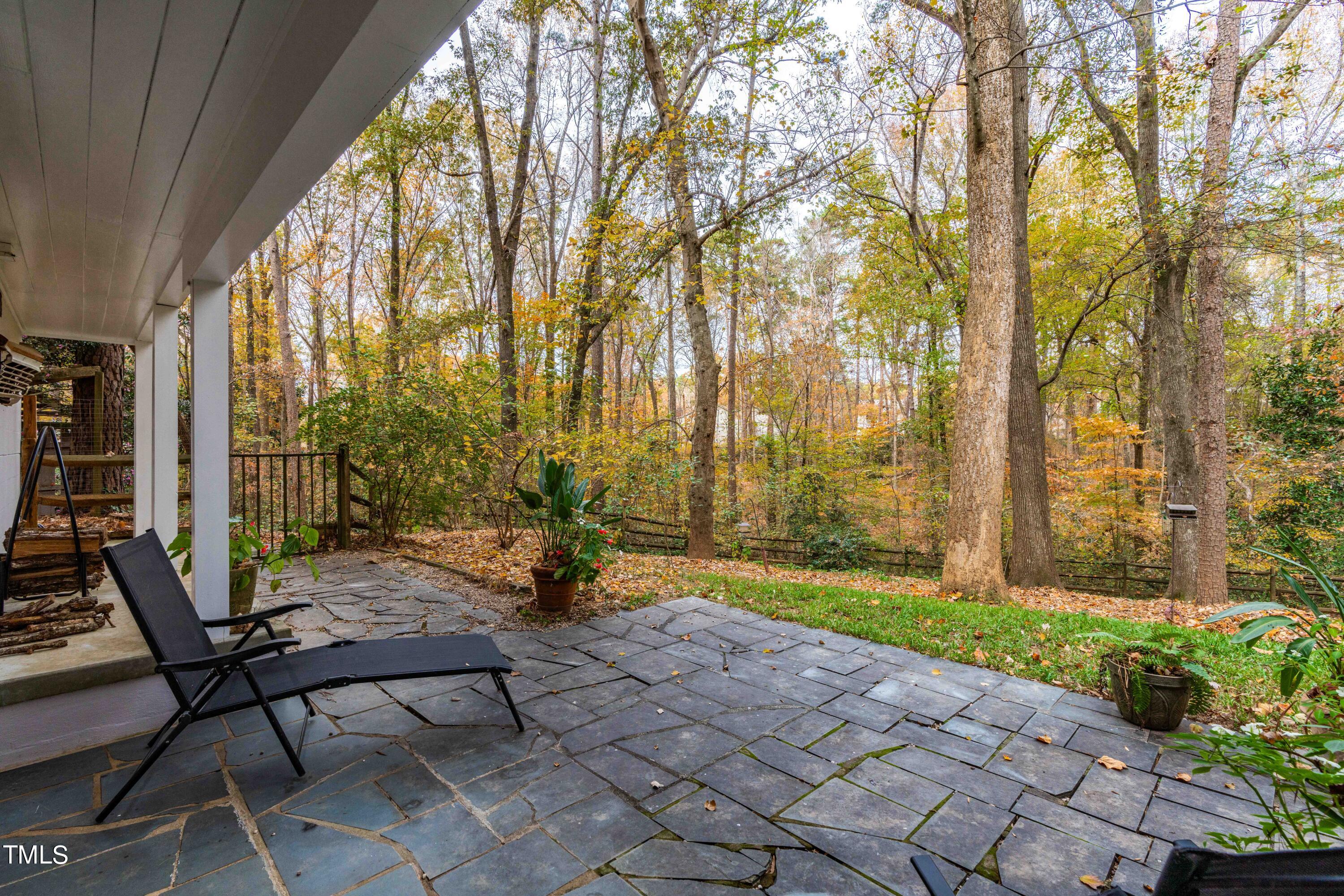 3120 Tanager Street Raleigh, NC 27606 - Photo 43 of 70 a view of a patio with table and chairs and potted plants
