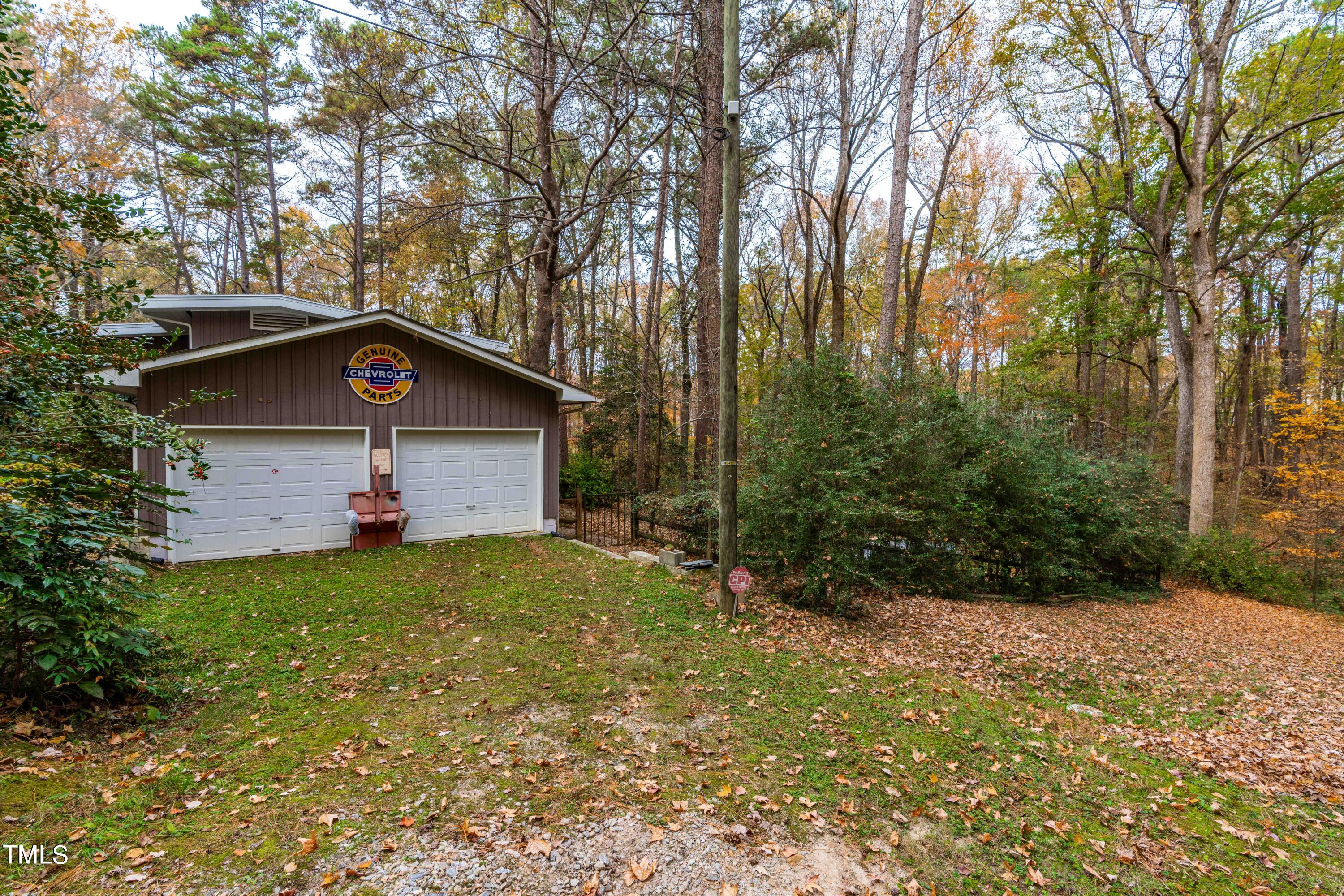 3120 Tanager Street Raleigh, NC 27606 - Photo 49 of 70 a front view of a house with a yard