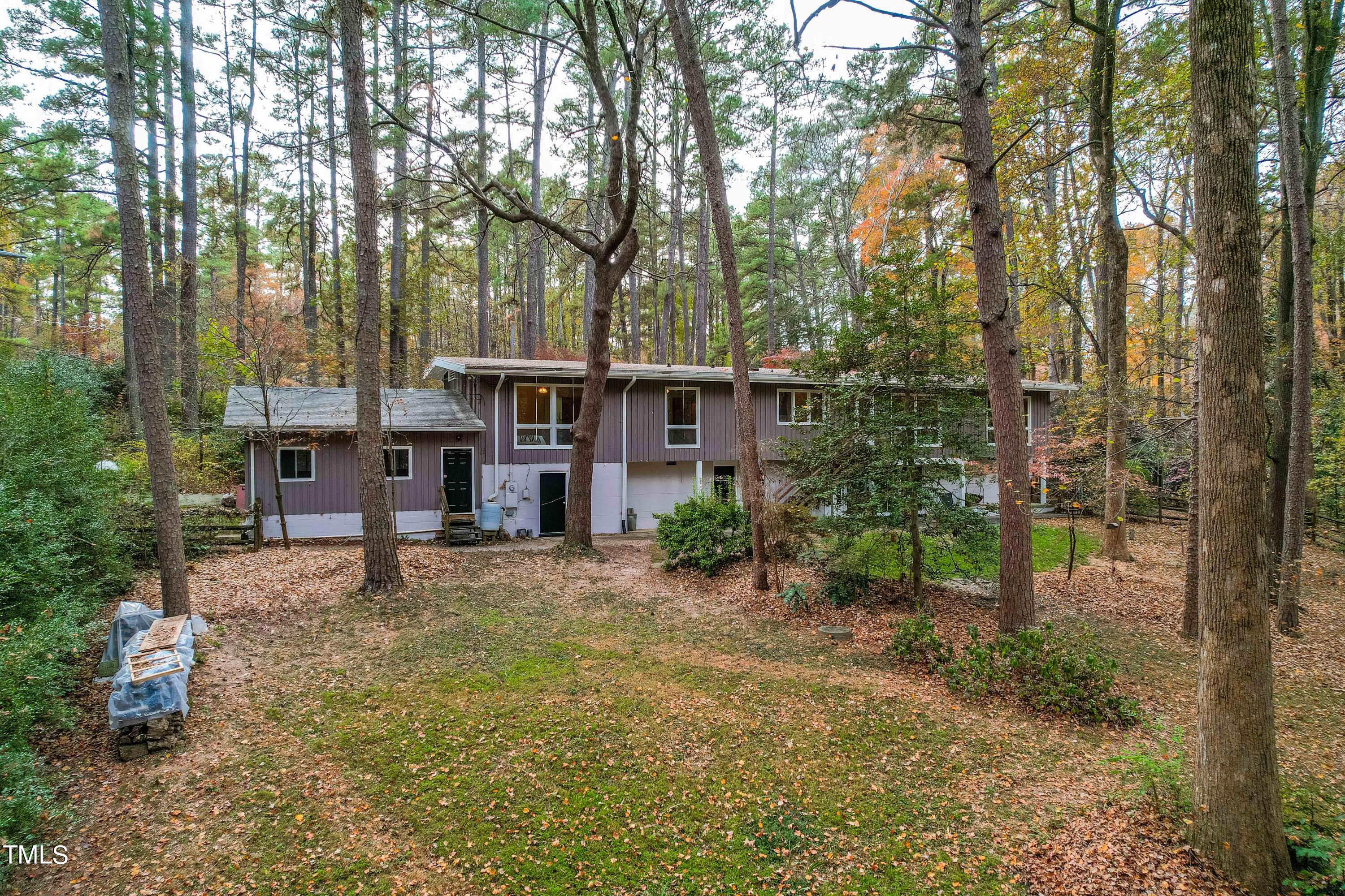 3120 Tanager Street Raleigh, NC 27606 - Photo 61 of 70 a view of a house with a yard and sitting area