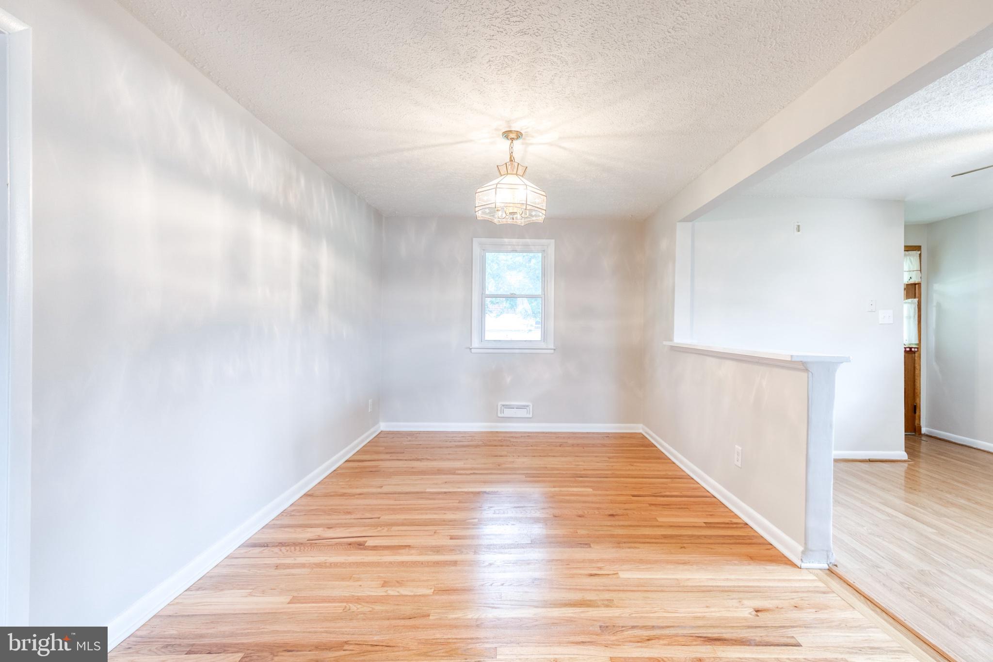 8306 Berkfield Road Baltimore, MD 21237 - Photo 11 of 29 Bright and airy open dining space awaits.