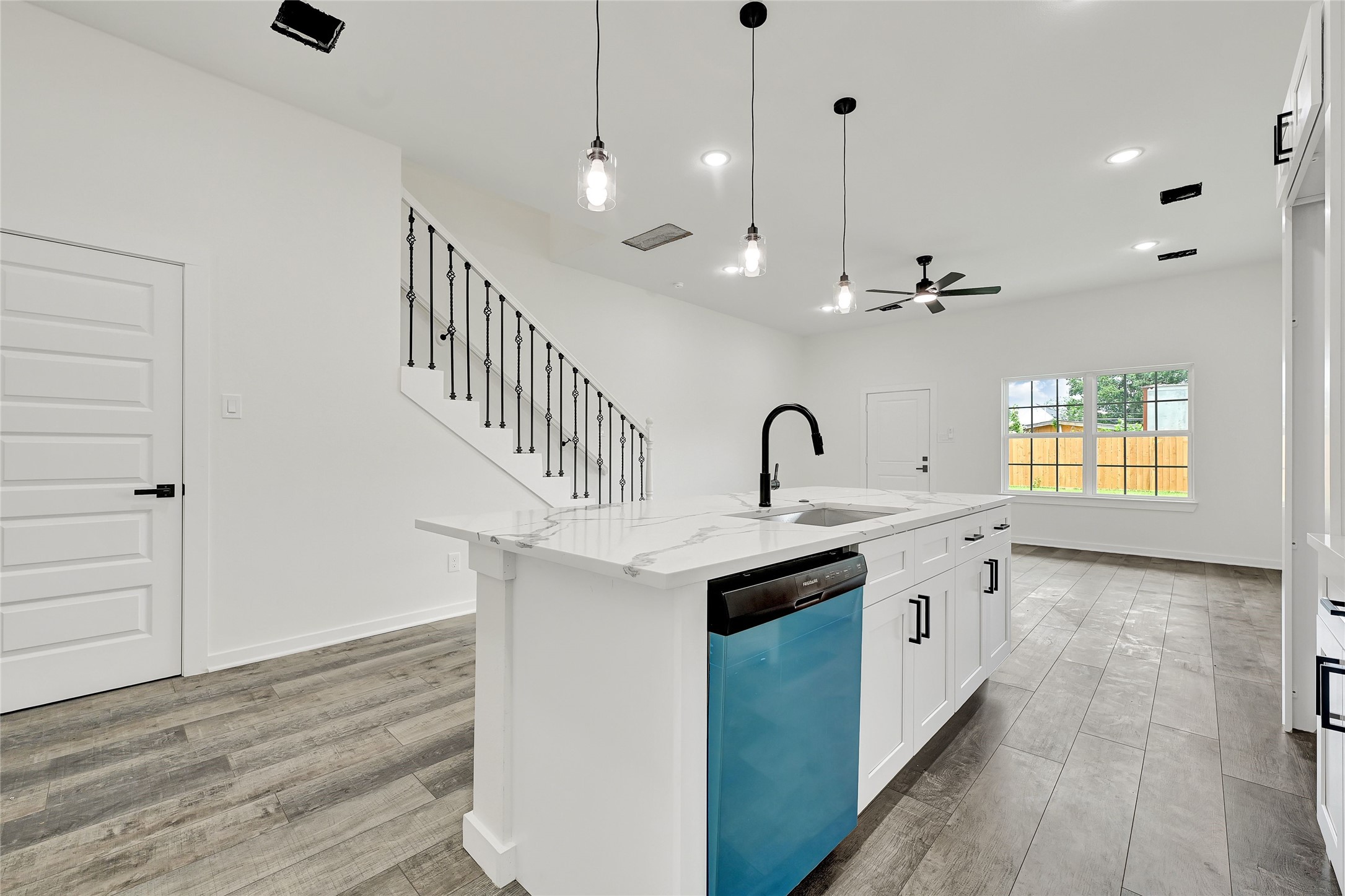 7922 Sealey Street Houston, TX 77088 - Photo 11 of 16 a kitchen with kitchen island a sink stainless steel appliances and cabinets