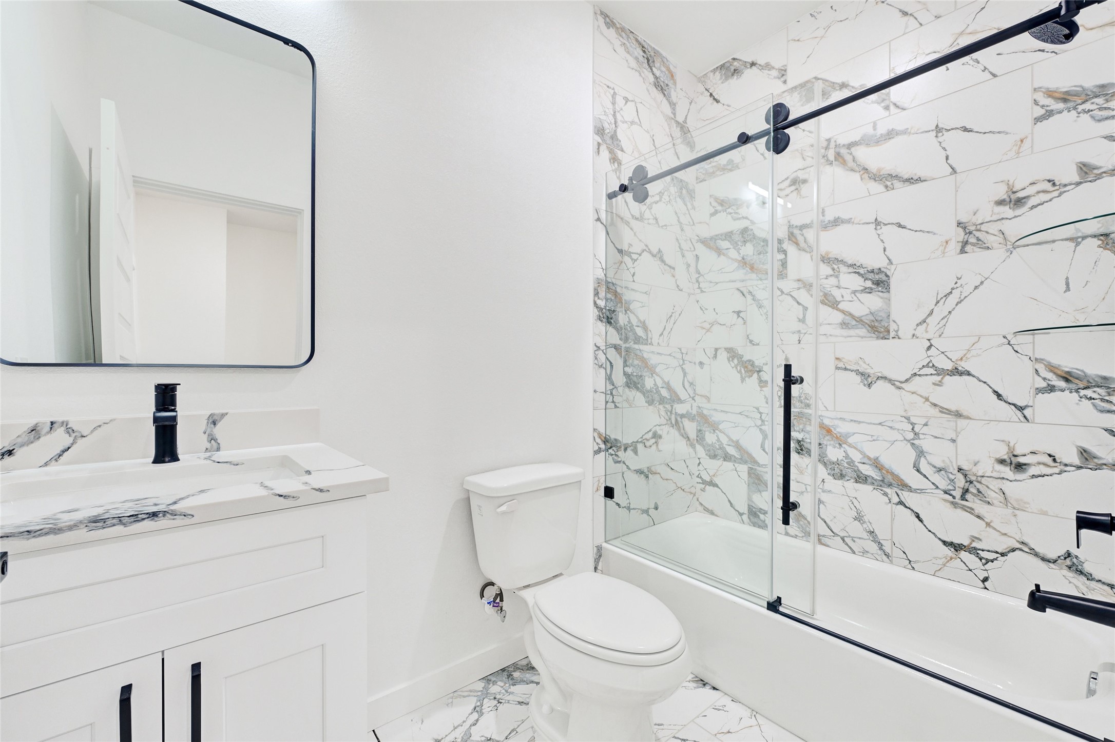 7922 Sealey Street Houston, TX 77088 - Photo 9 of 16 a bathroom with a sink toilet vanity and shower