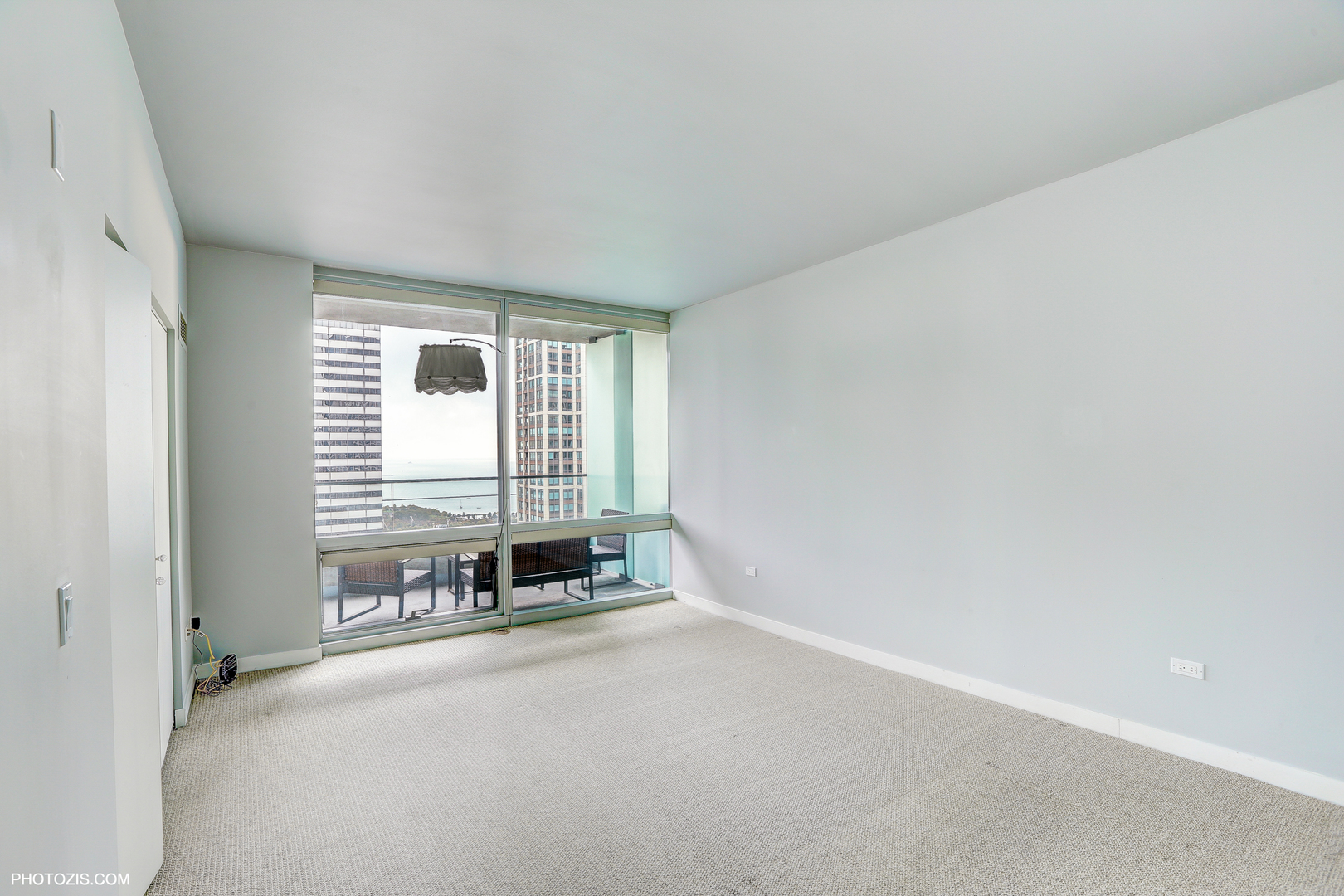 8 East Randolph Street, Unit 2702 Chicago, IL 60601 - Photo 4 of 9 an empty room with windows