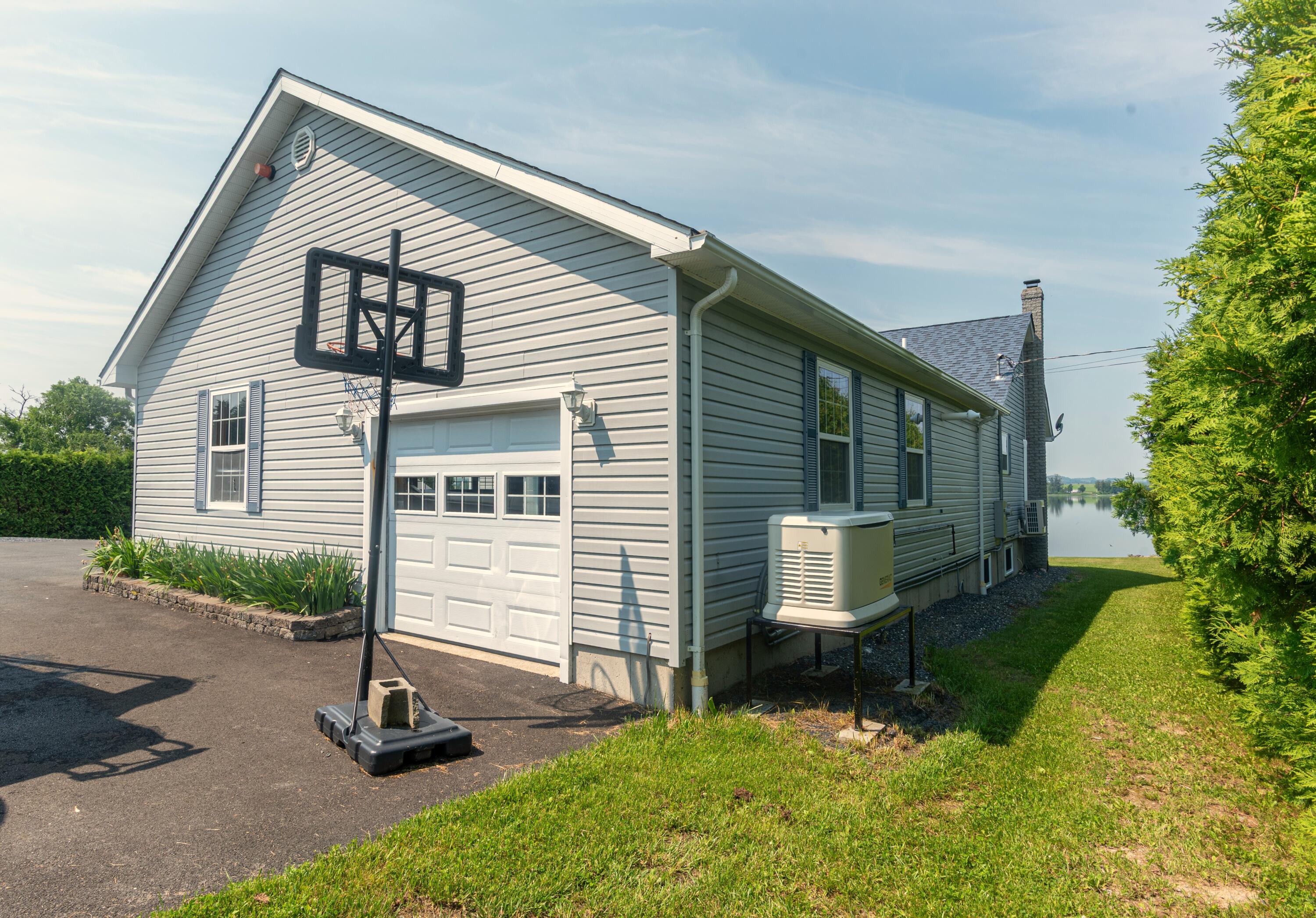 149-161 Lake Shore Road, Unit LOT 202 St. David, ME 04773 - Photo 16 of 62 Side garage door