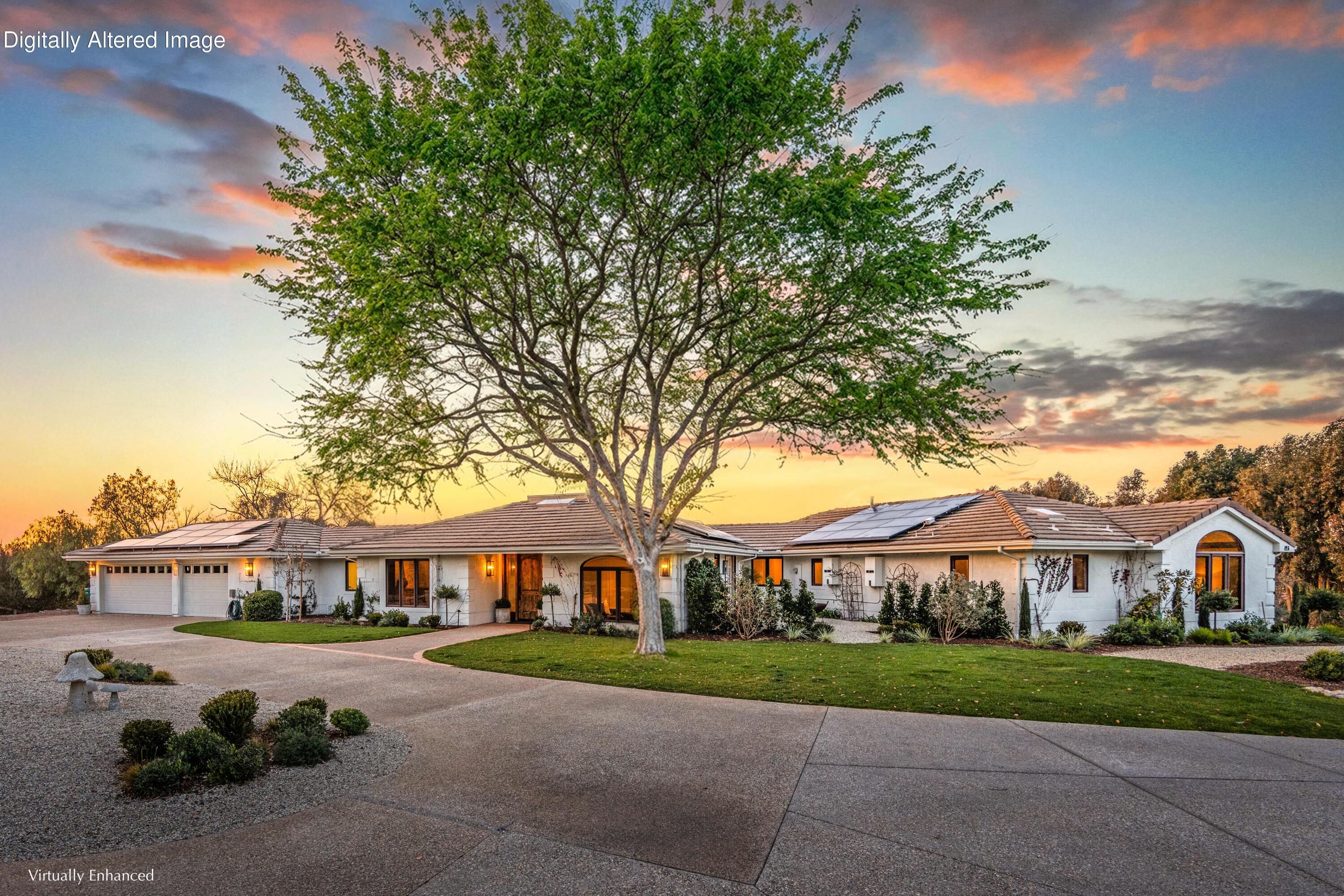a view of a big house with a big yard and potted plants